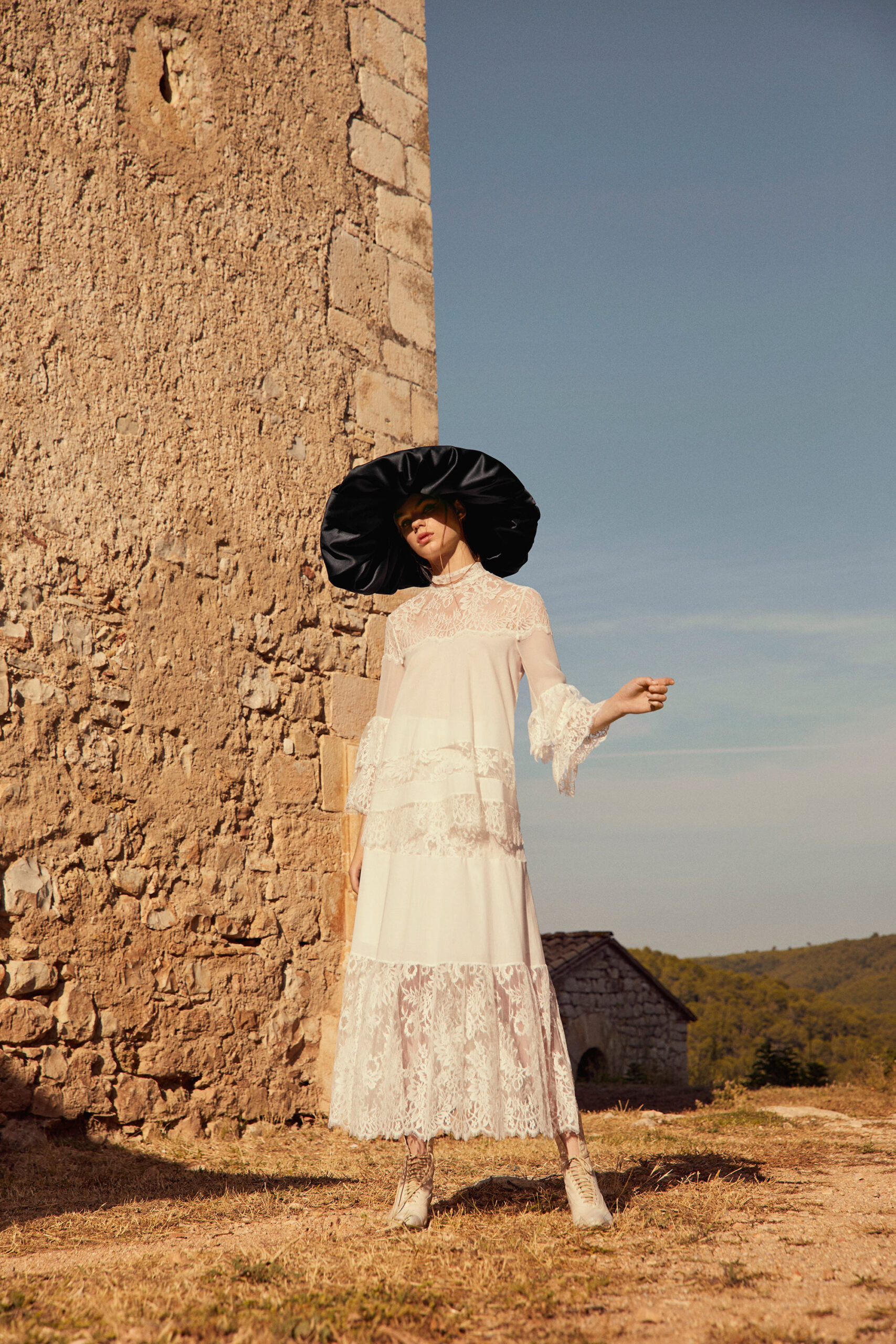 white lace maxi dress with black hat