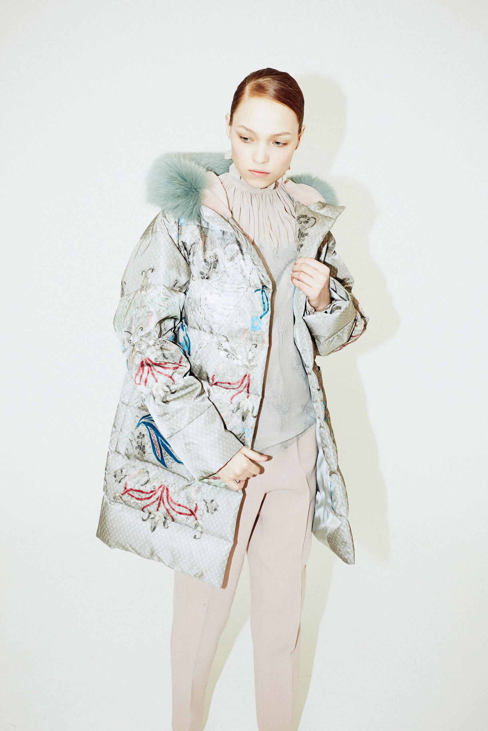 silver embroidered coat with pink blouse