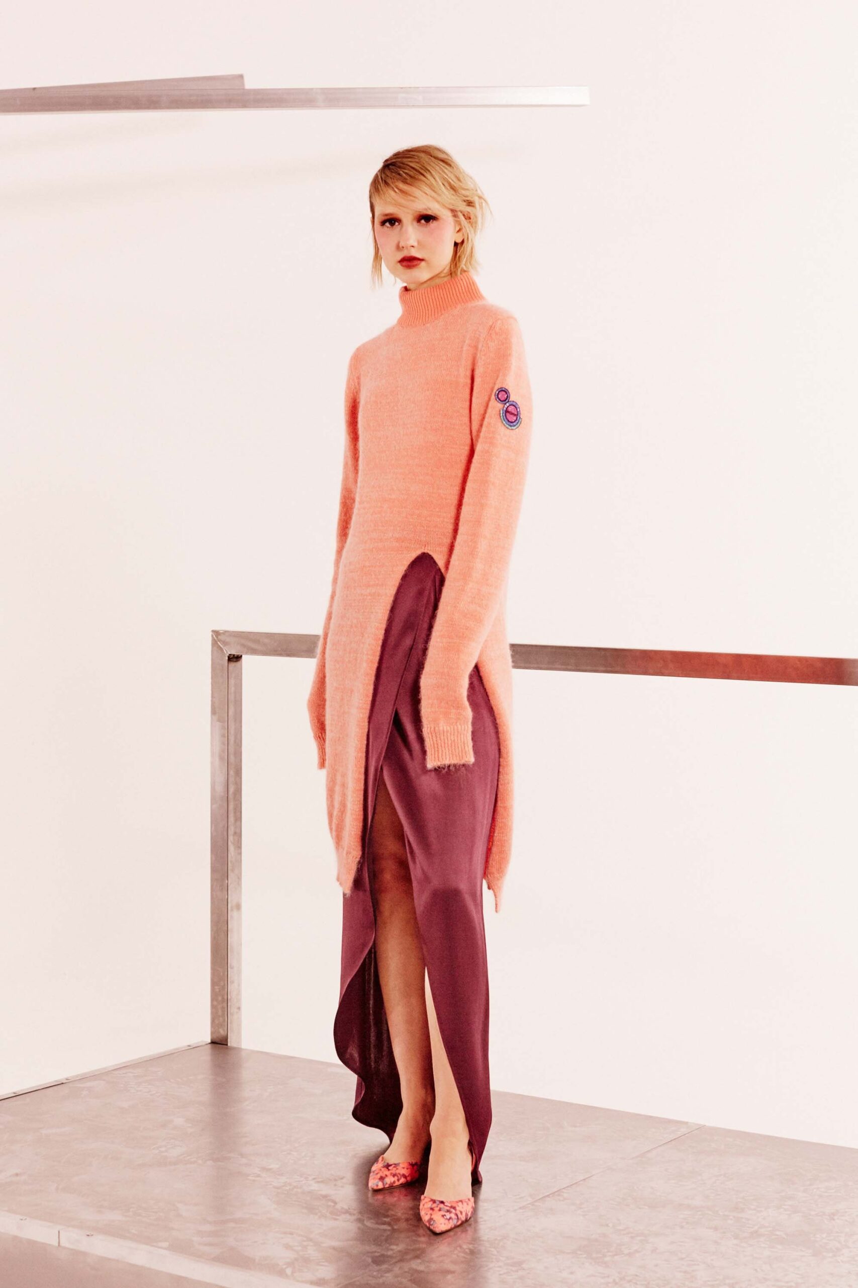 pink wool long-sleeve turtleneck relaxed draped sweater