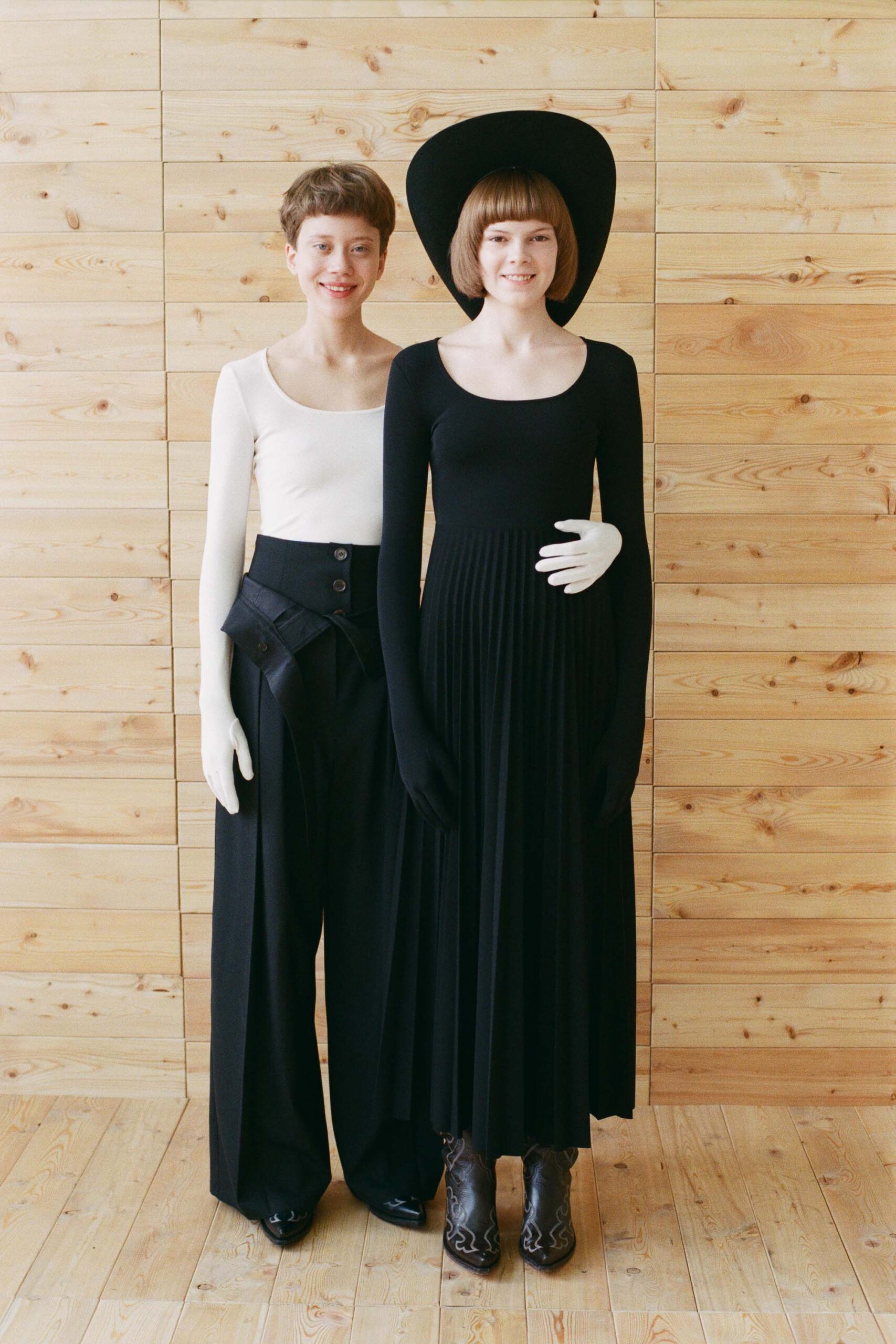 white fitted top black relaxed pants black maxi dress