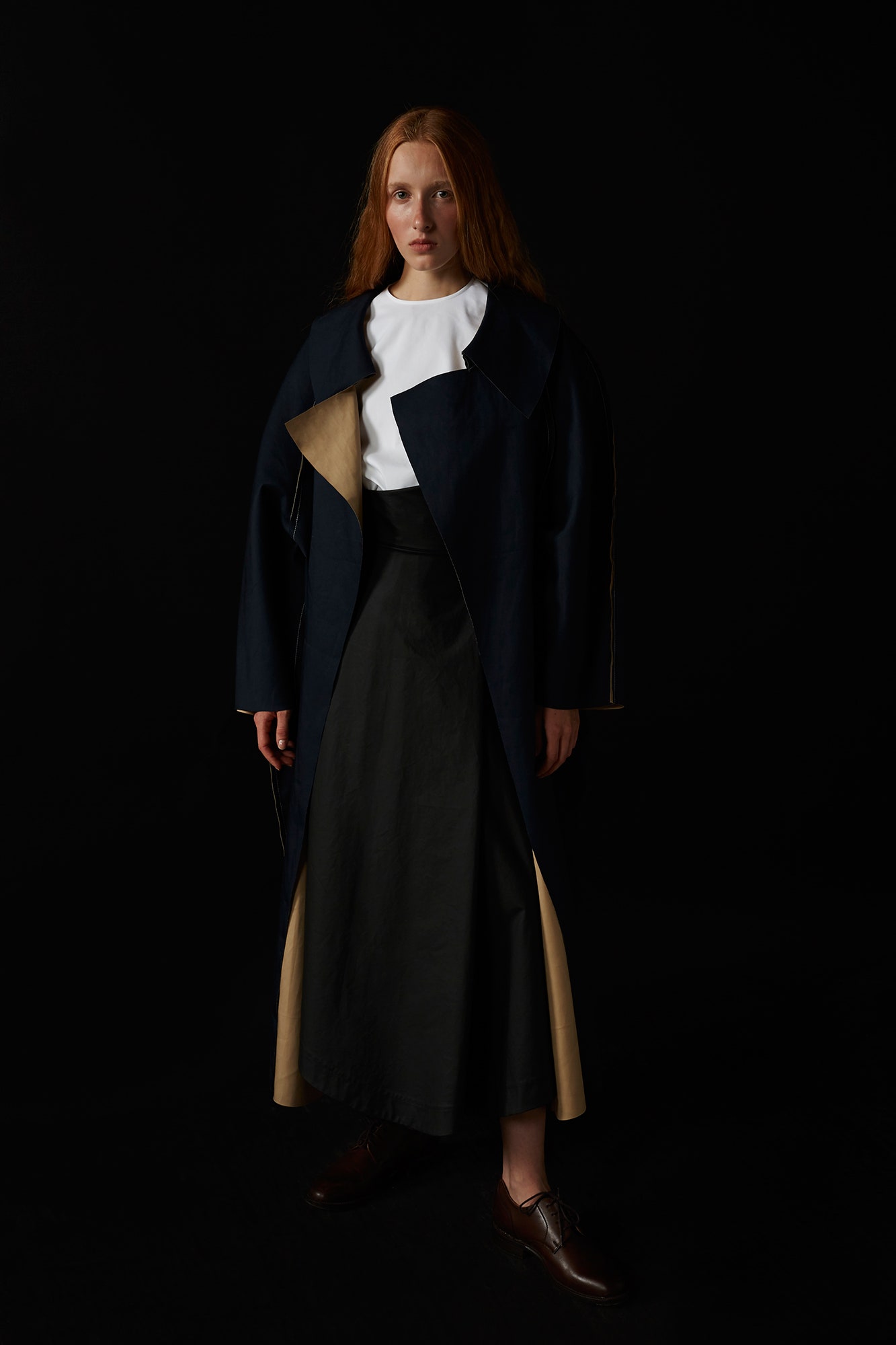 navy coat with black skirt