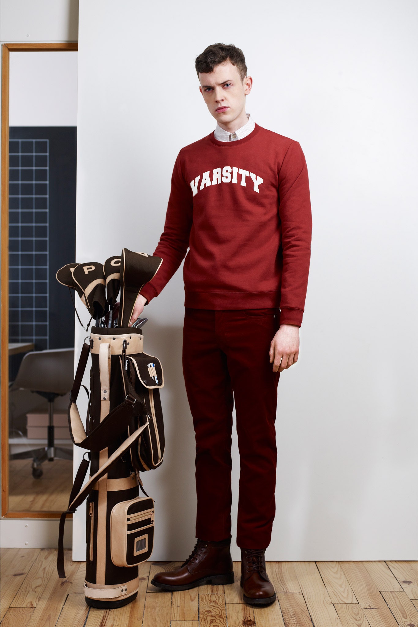 red cotton sweater with brown pants