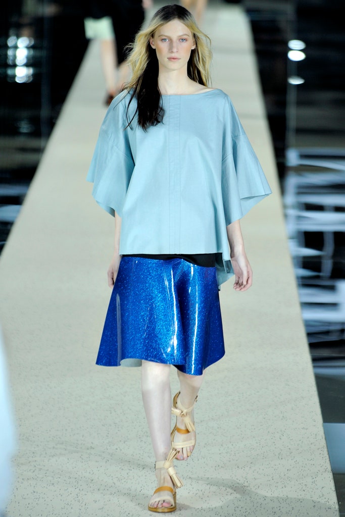blue relaxed top and shiny skirt