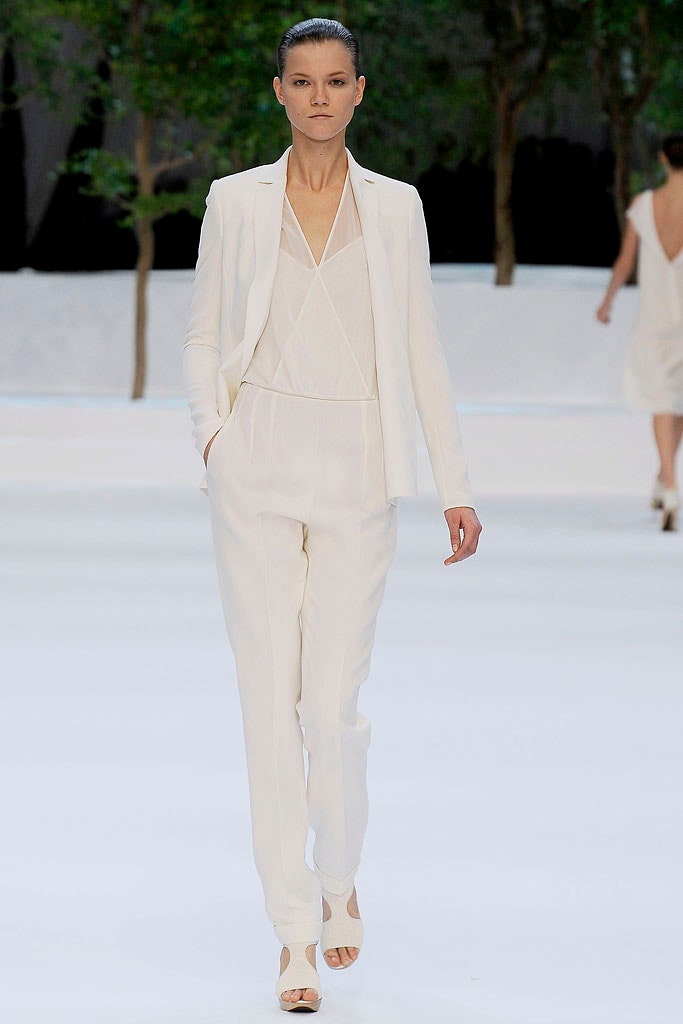 white tailored suit with open-toe shoes