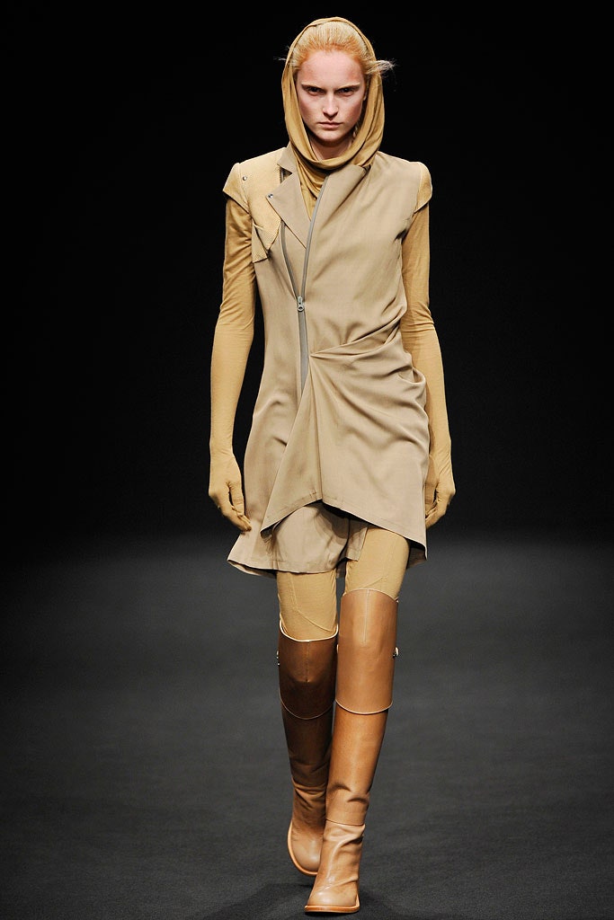 beige asymmetric sleeveless dress with brown boots