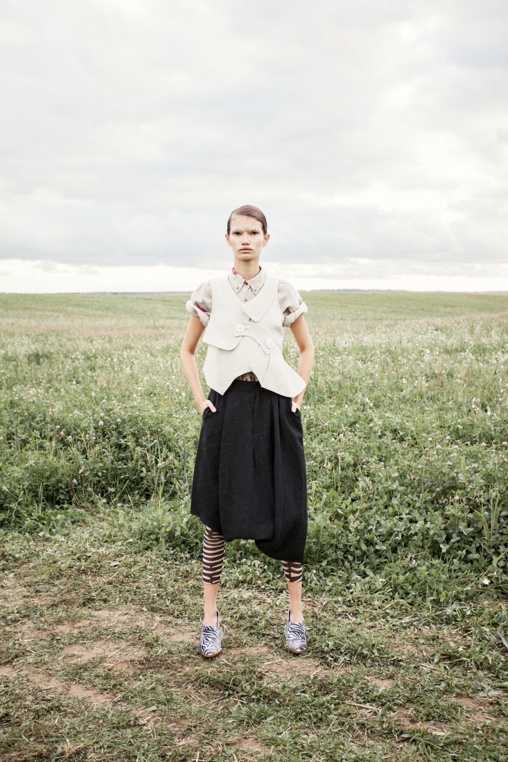 beige cotton vest with black skirt