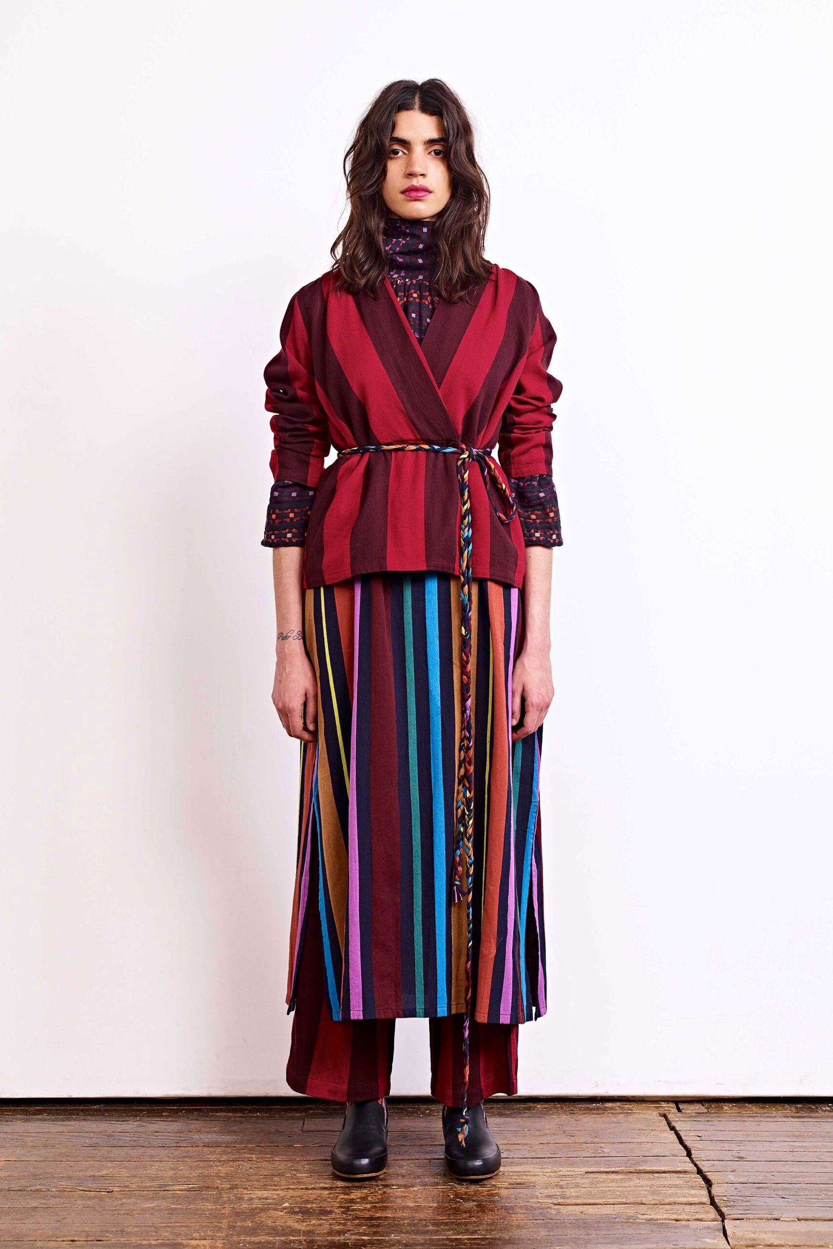 red and purple belted jacket with multi-colored skirt
