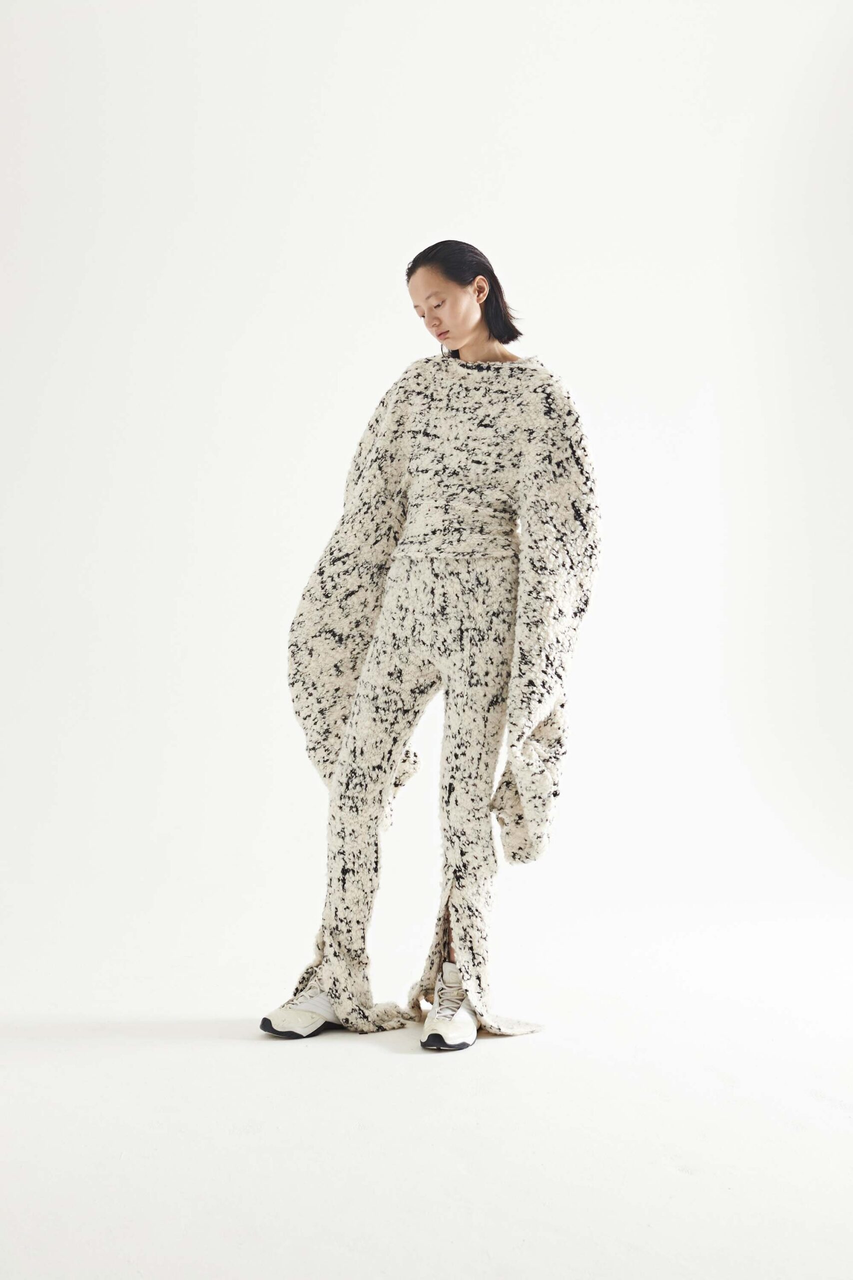 white and black relaxed top with fitted pants