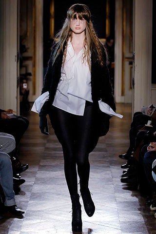 white relaxed blouse with black leggings
