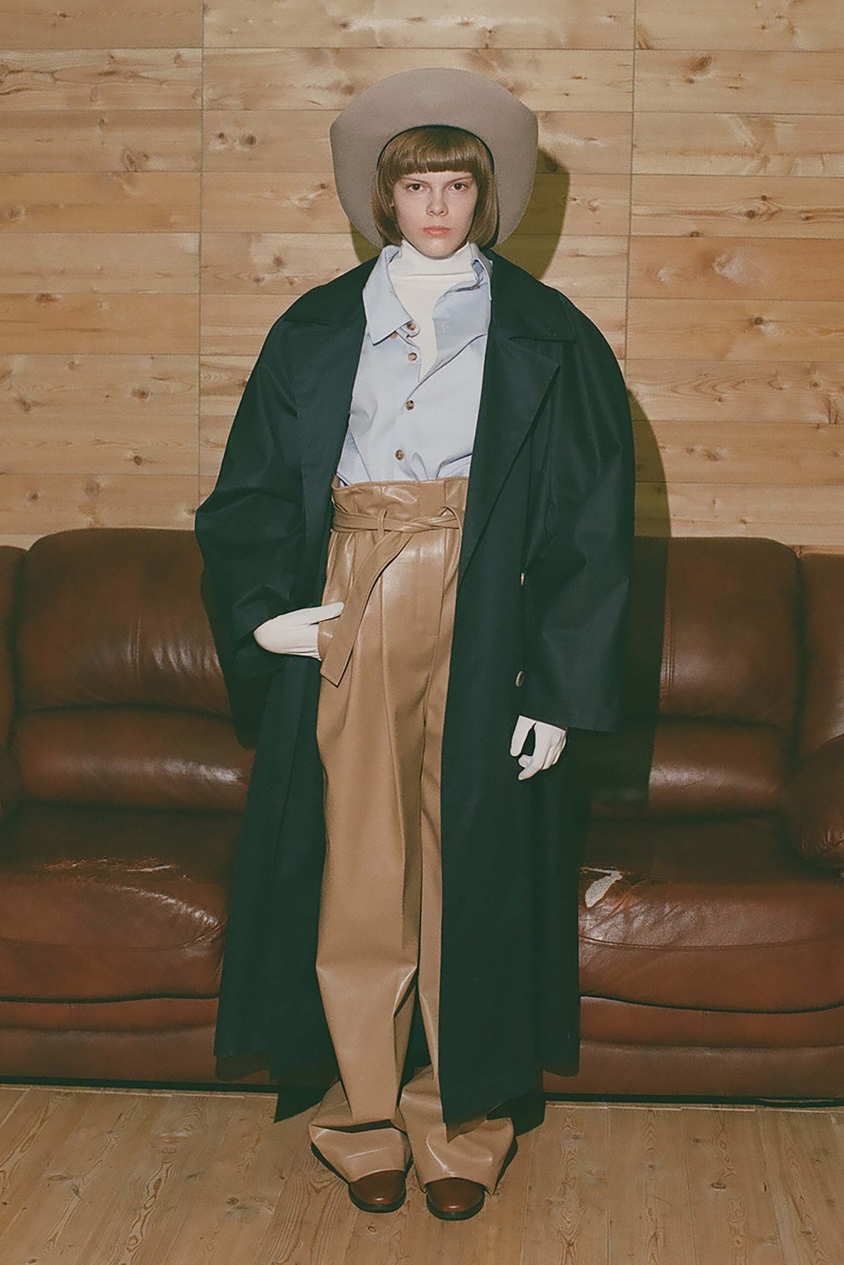 black wool coat with beige pants
