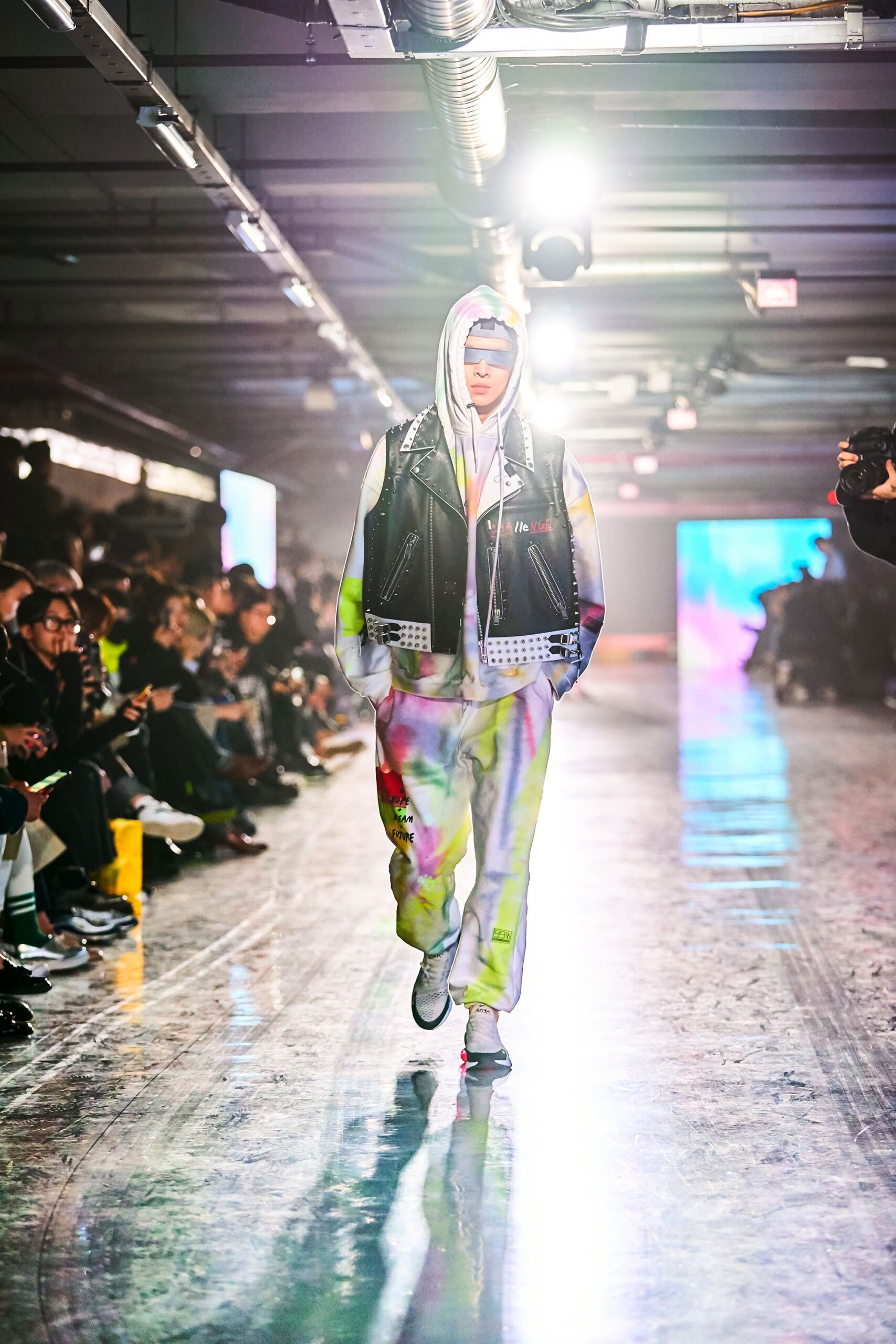 A relaxed fit multicolor denim jacket with a hood and printed pants.