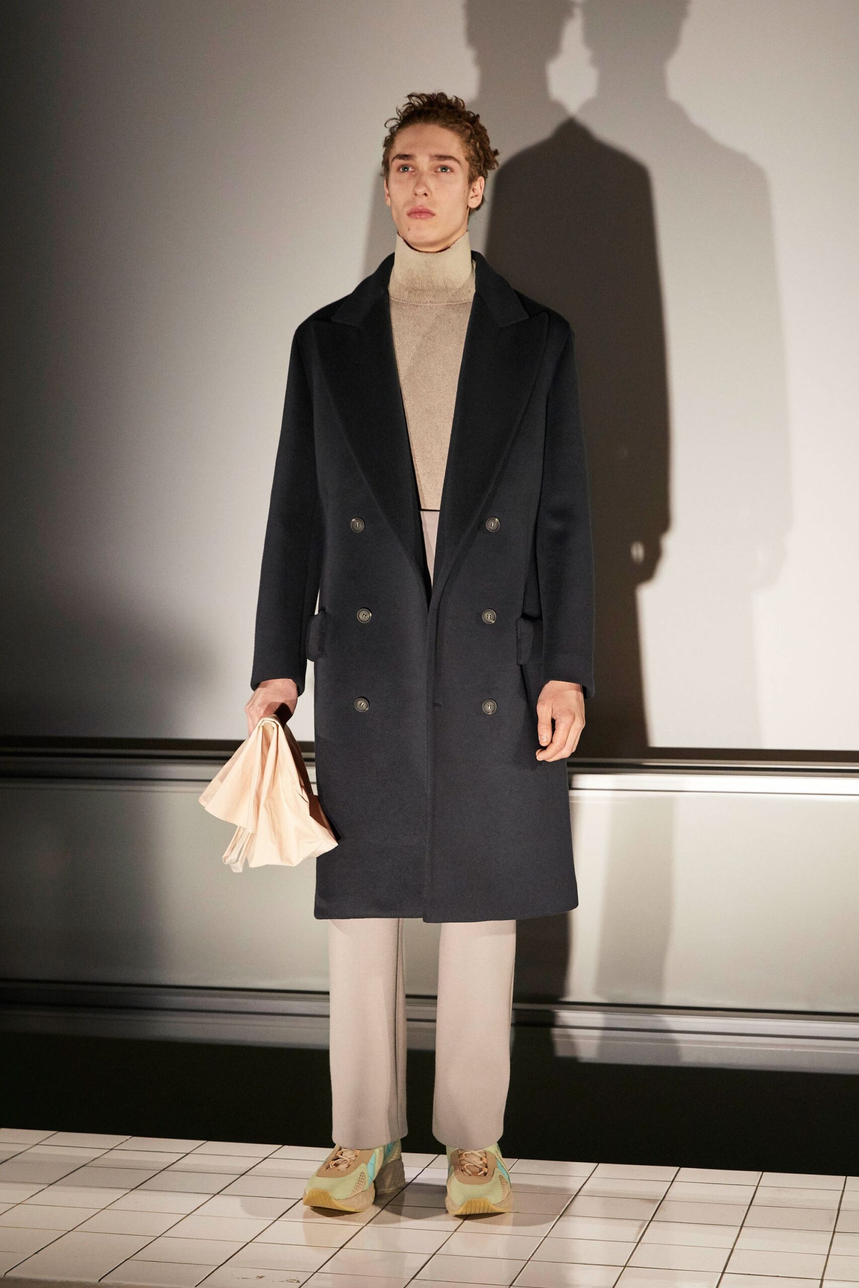 black wool tailored coat with beige turtleneck