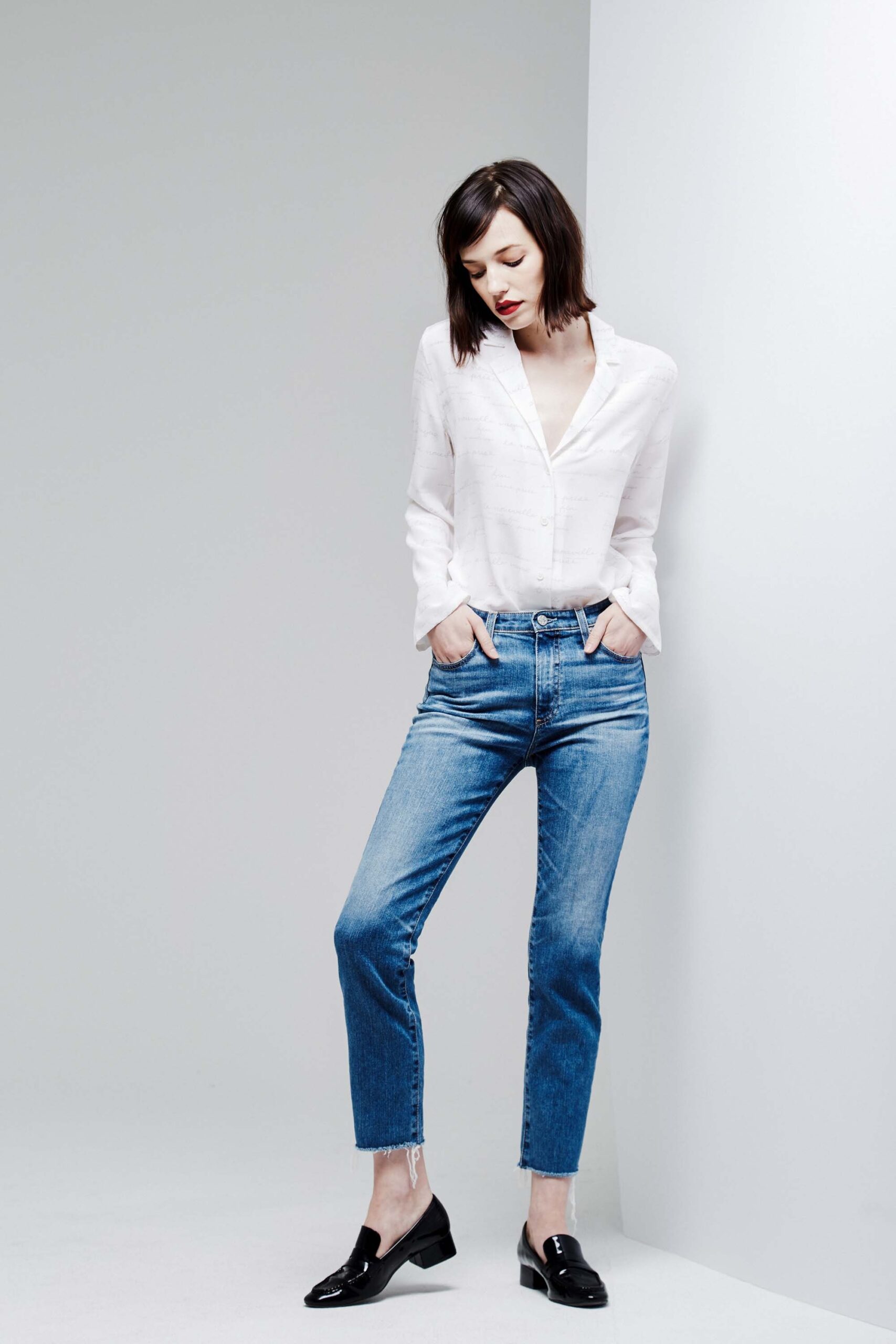 white relaxed shirt and blue jeans