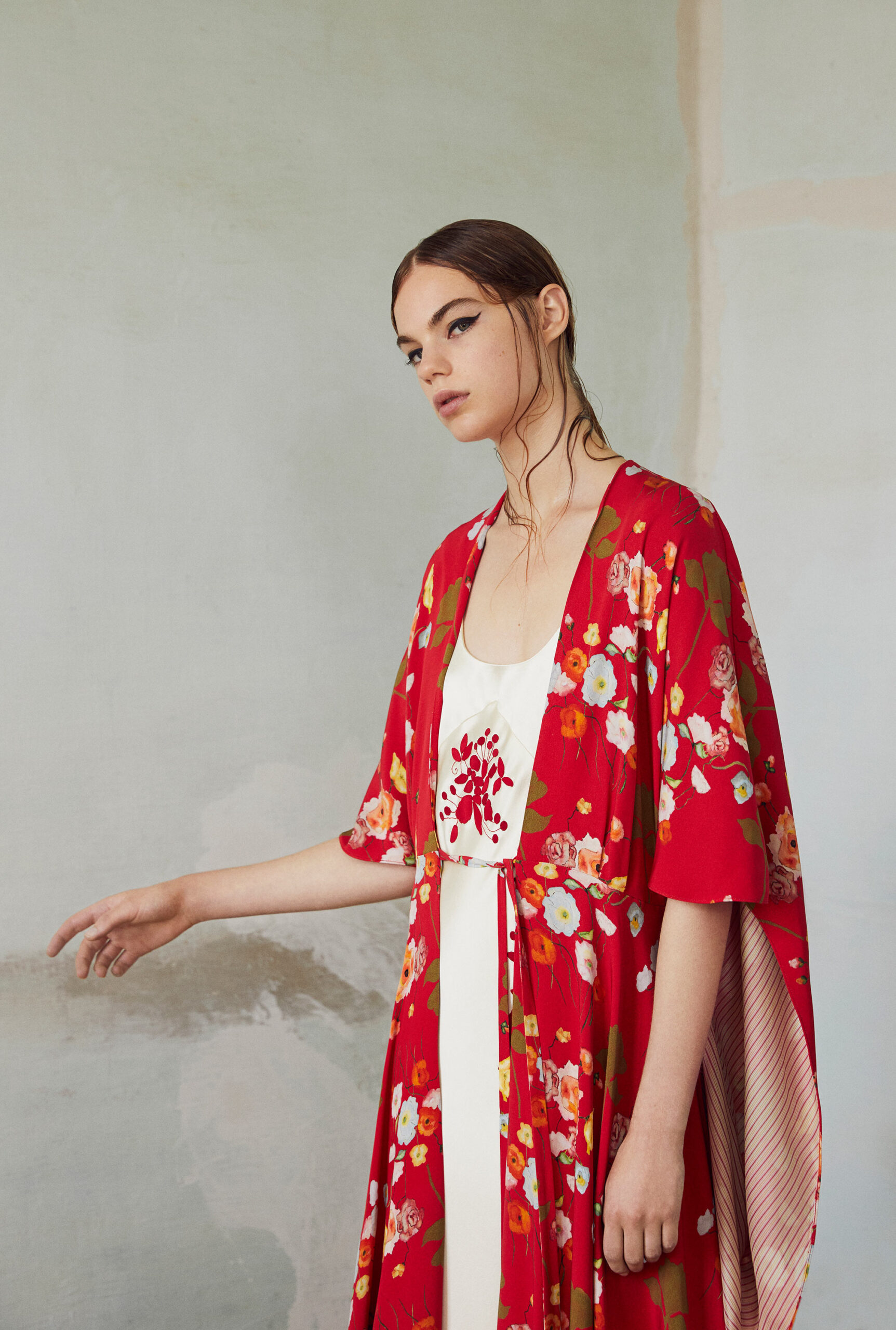 floral red cape over white dress