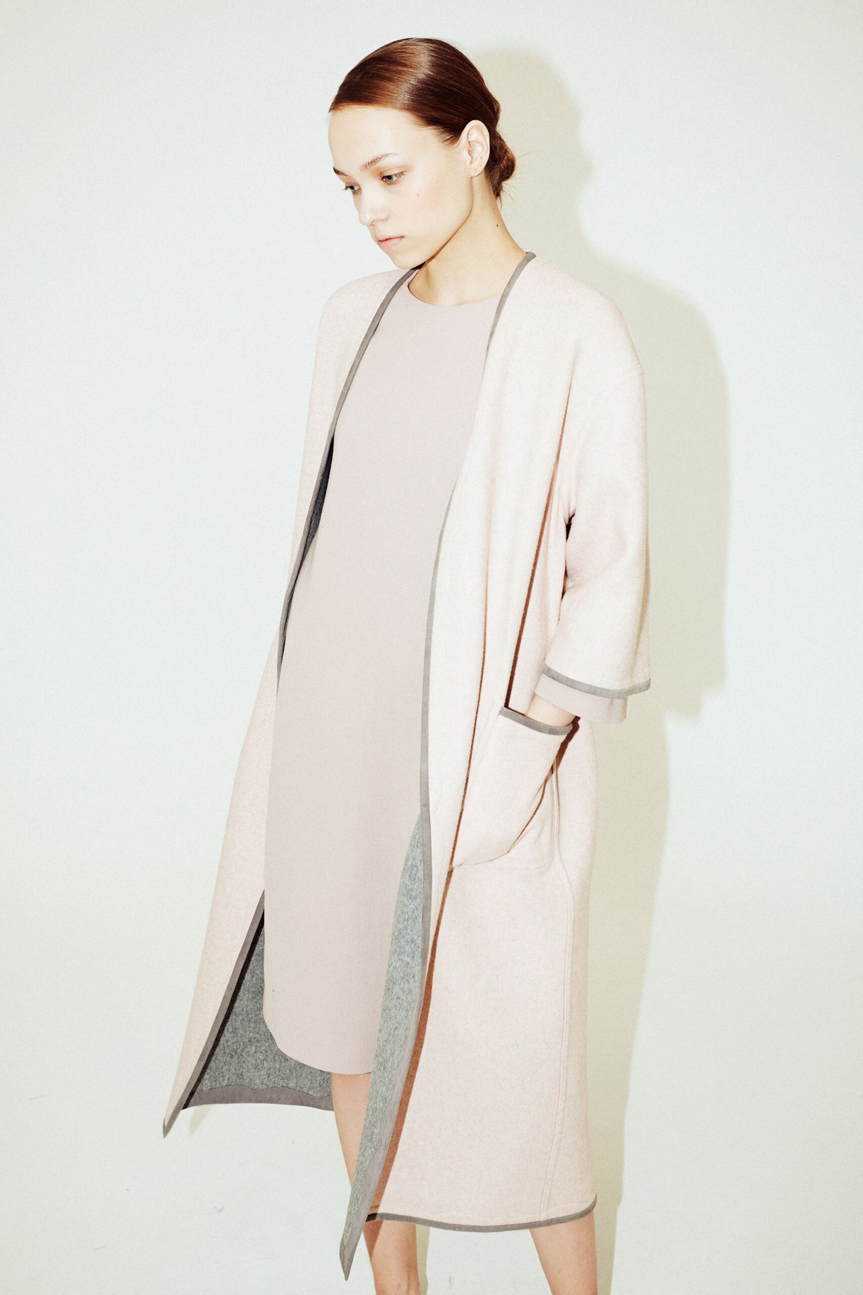 pink wool coat with beige dress