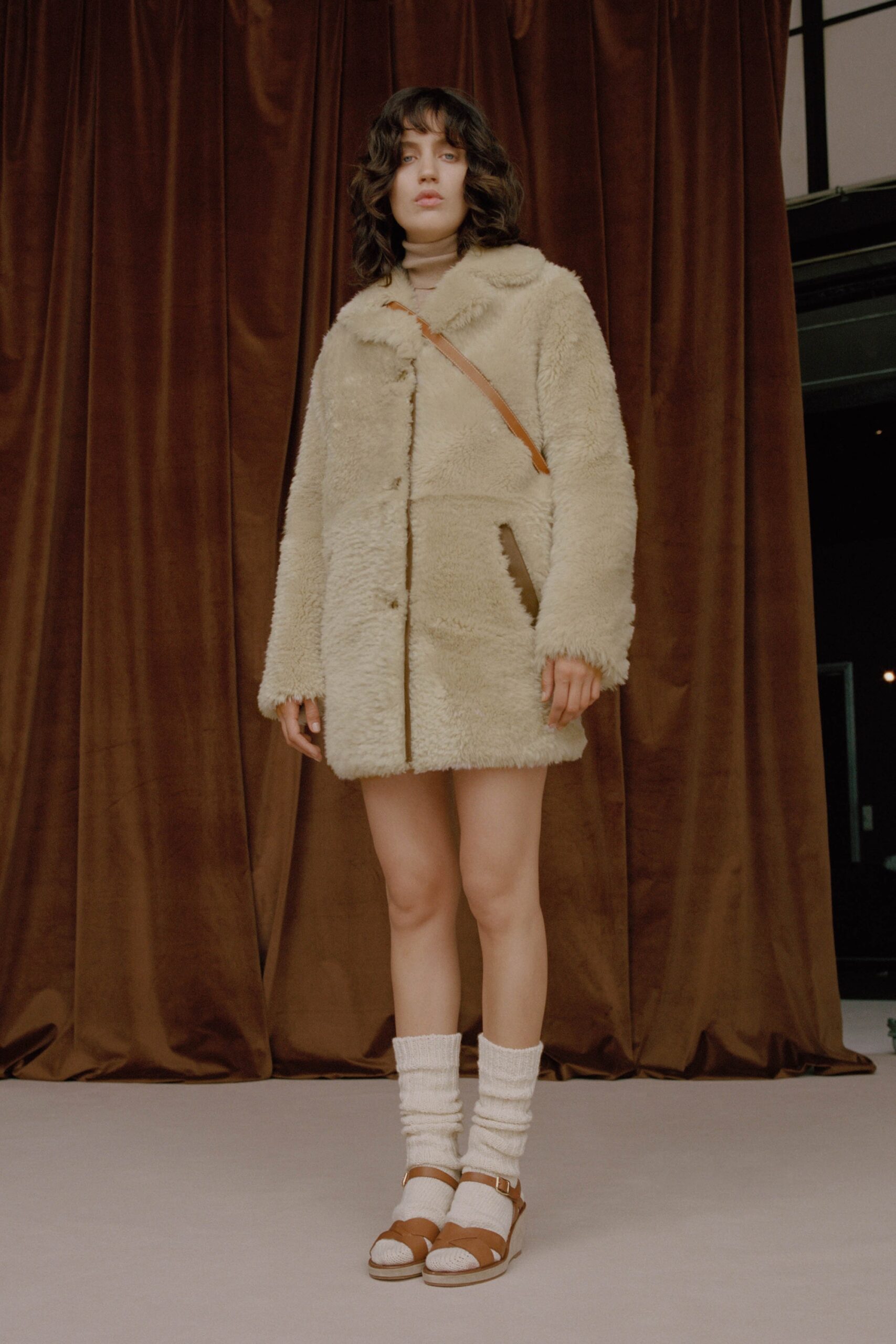 beige faux-fur coat with turtleneck