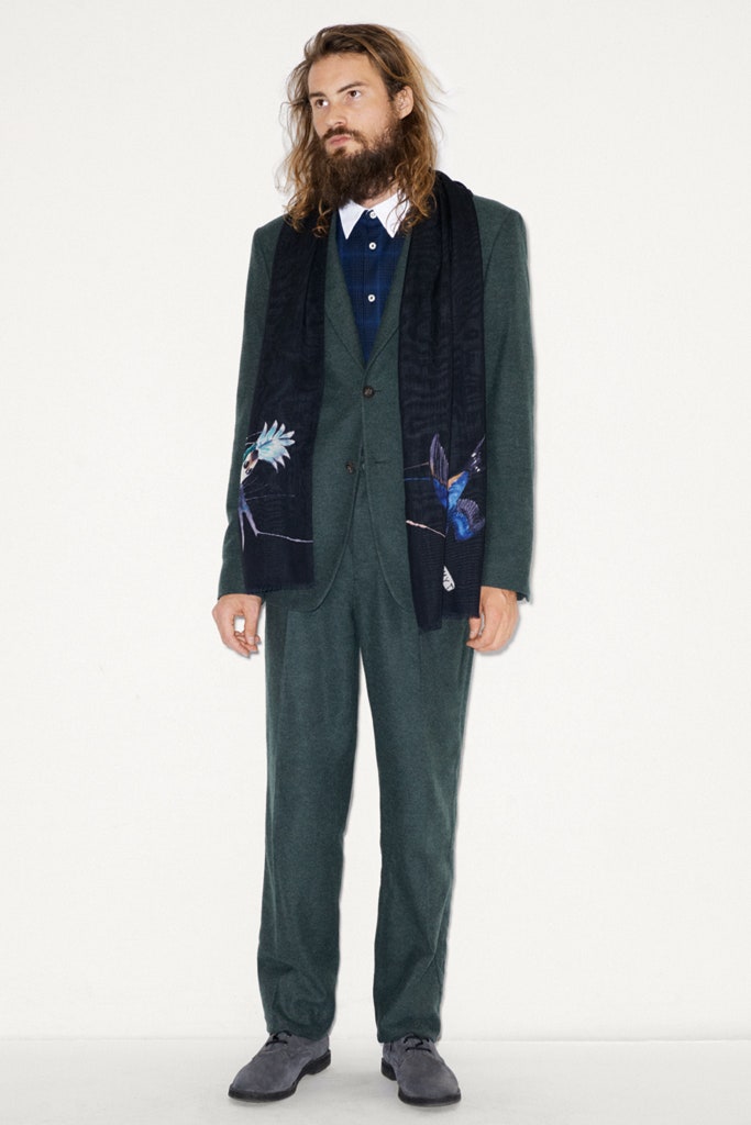 green tailored suit with scarf