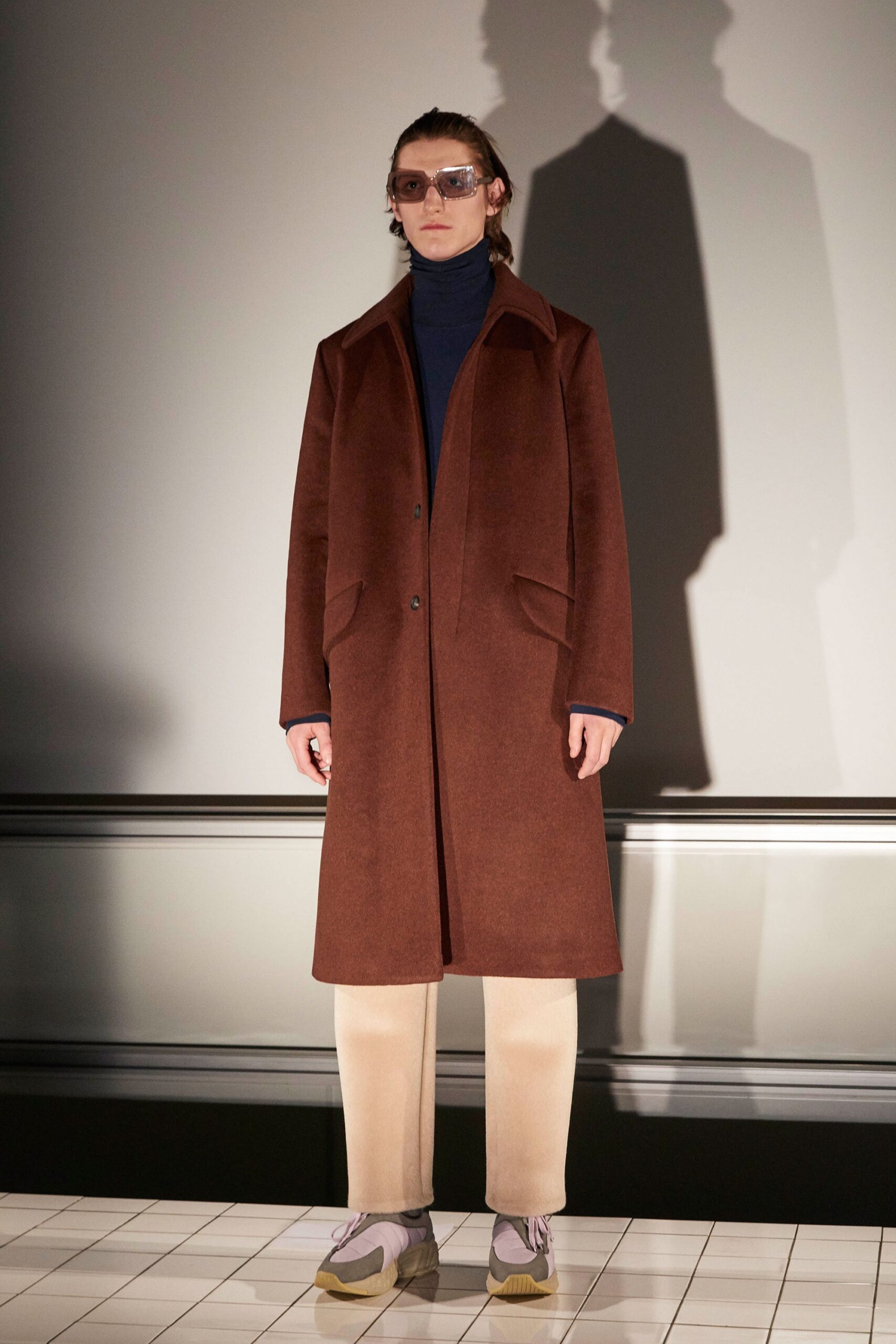 brown wool coat with navy turtleneck