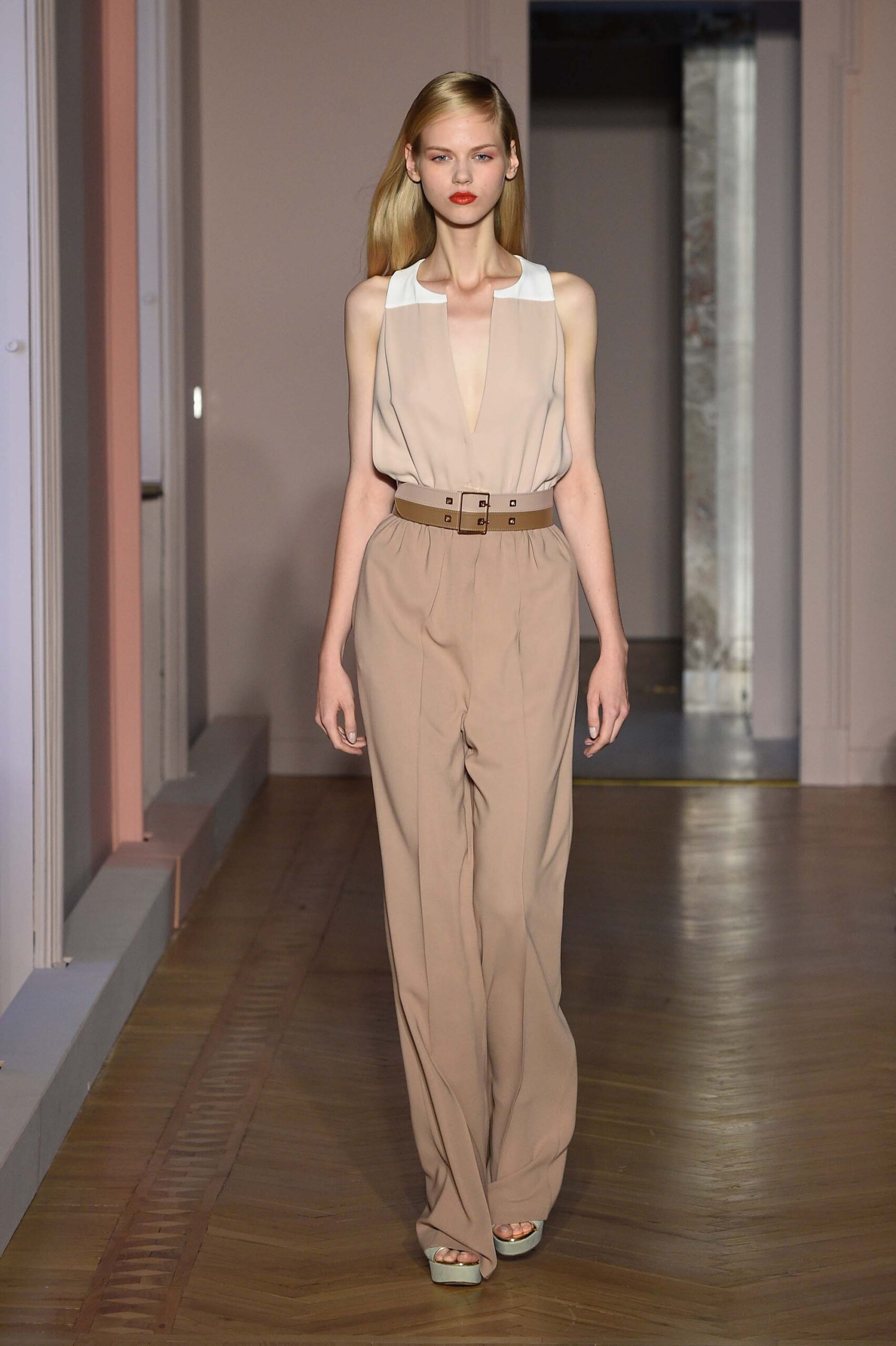 beige fitted top and tailored pants