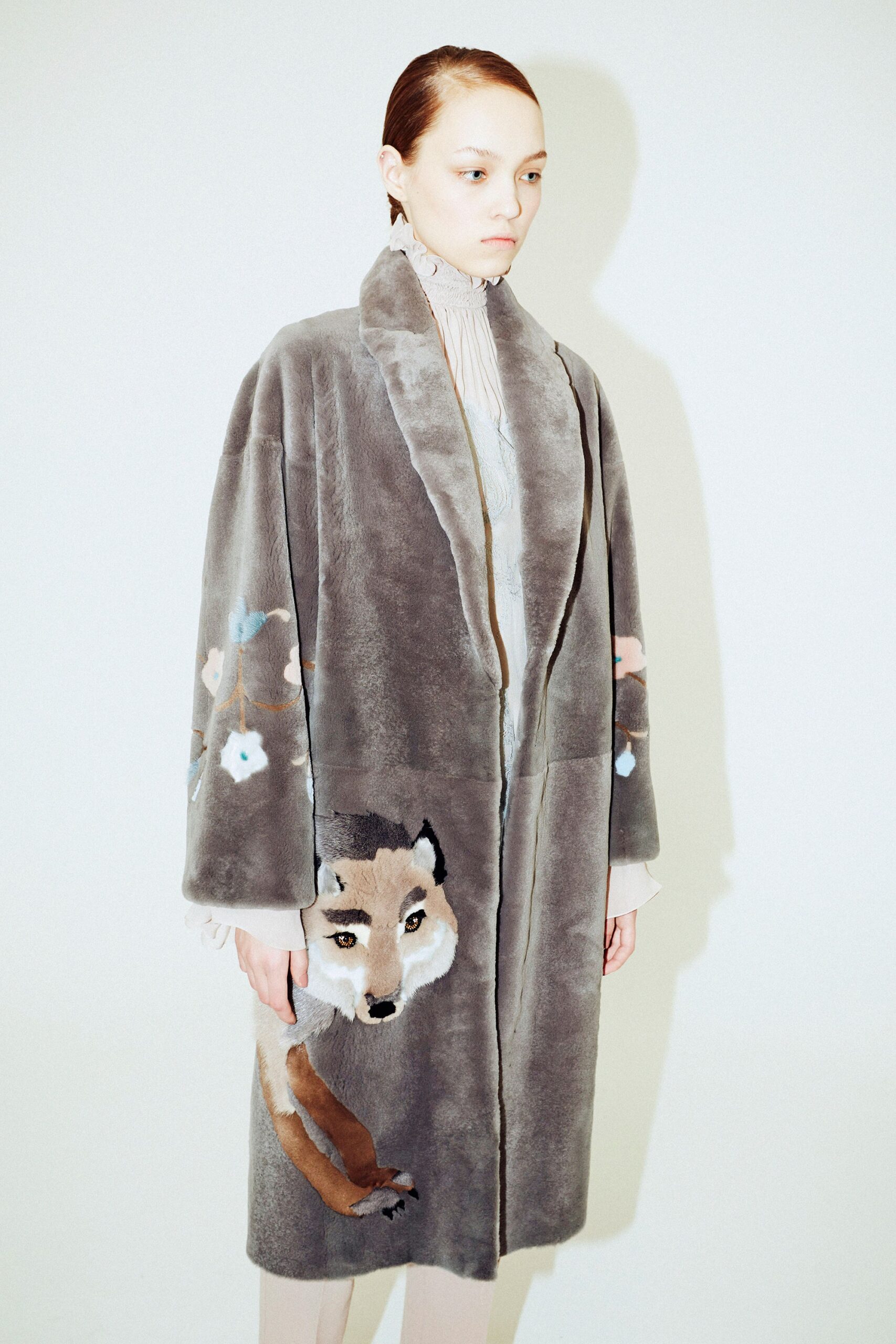 gray faux-fur coat and beige blouse