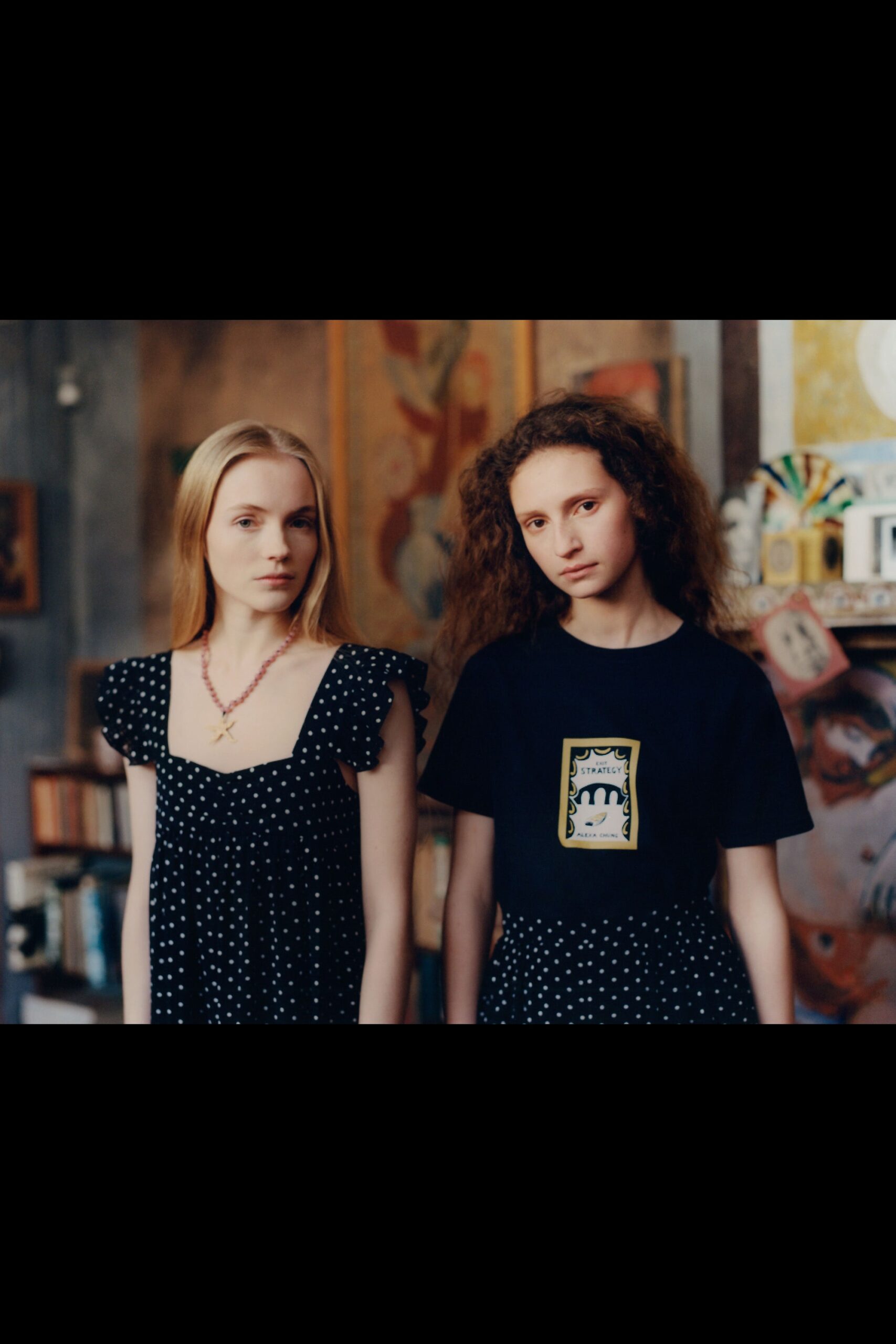 black polka-dot mini dress and black t-shirt