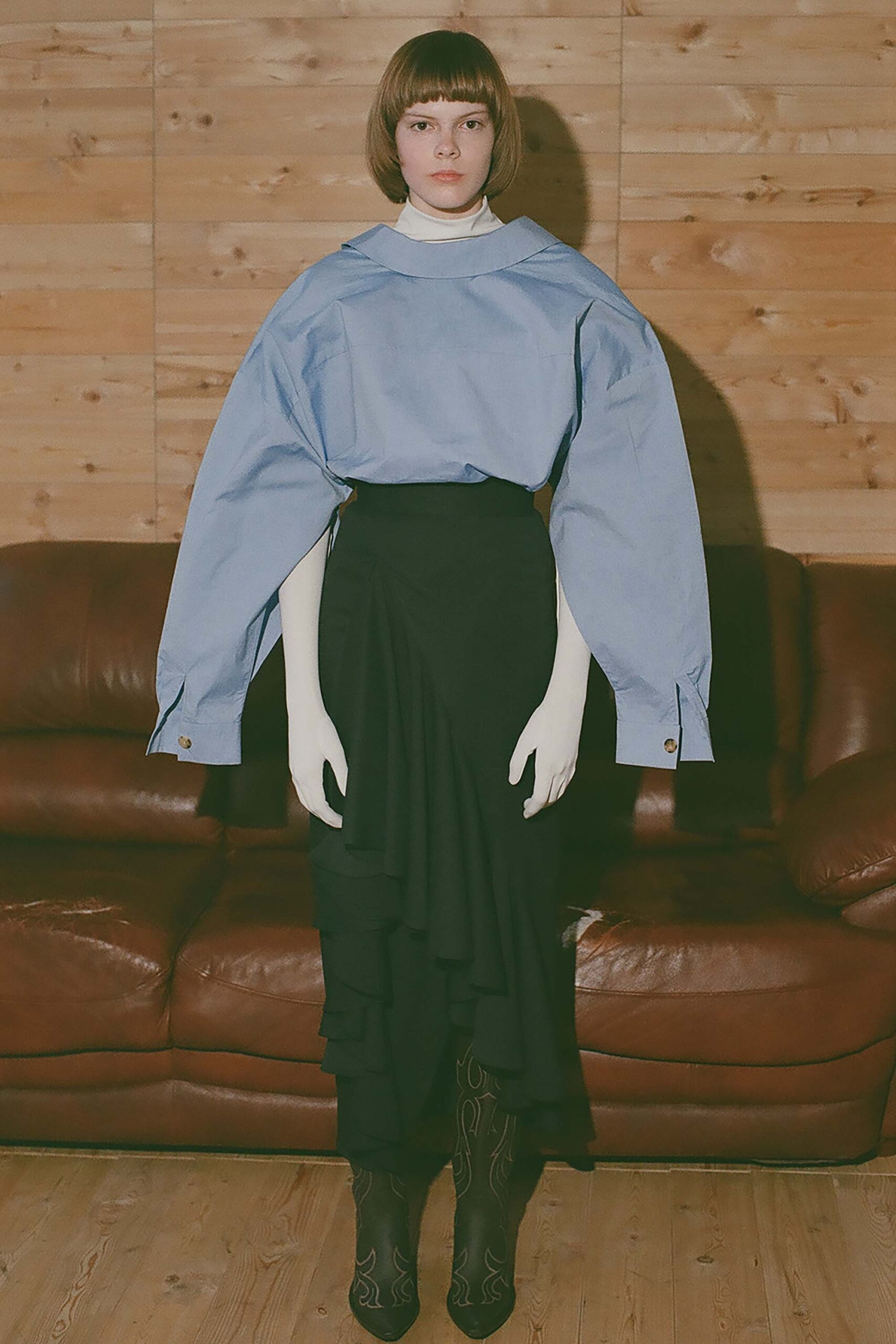 blue relaxed top with black skirt