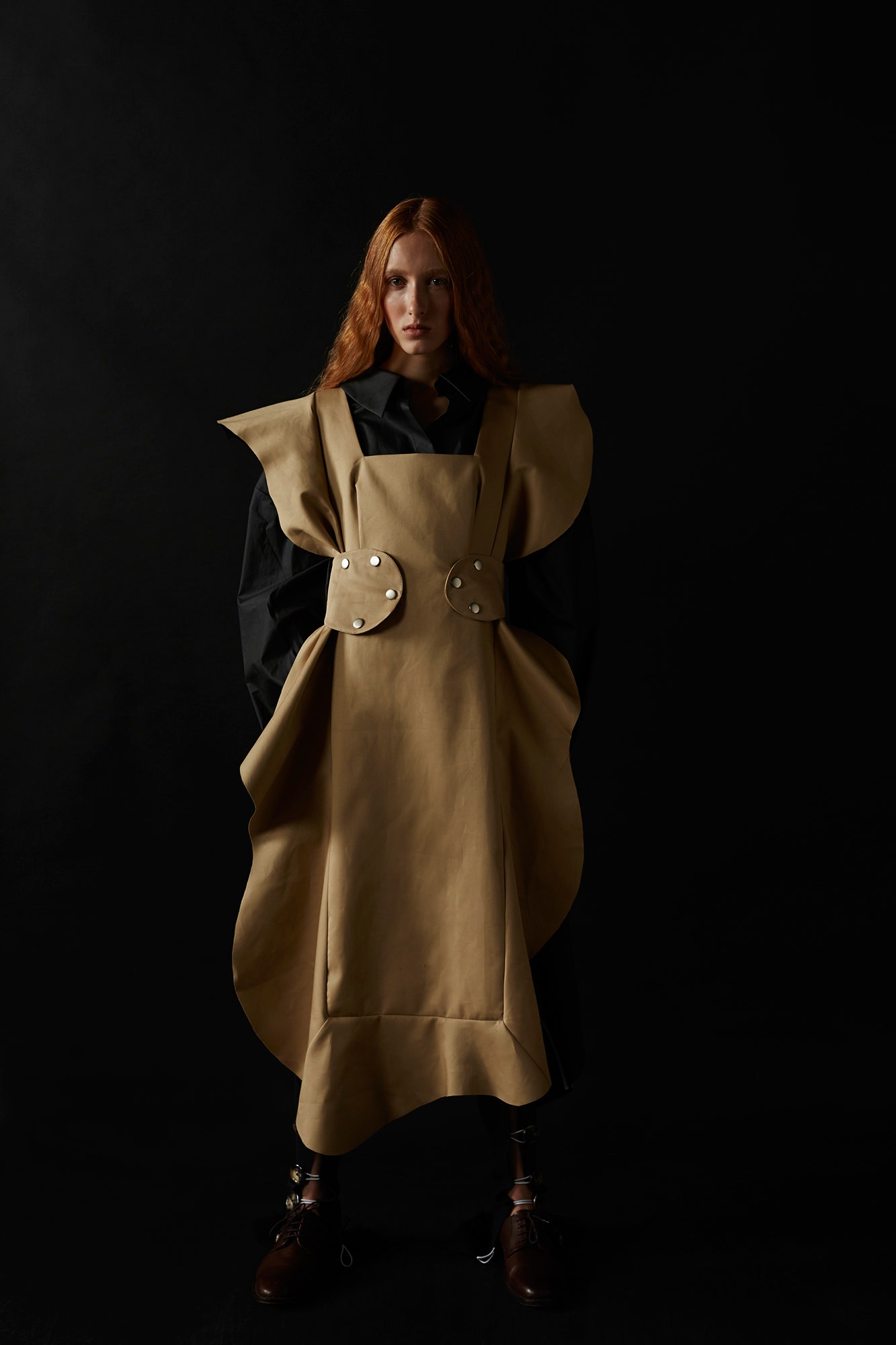 beige leather draped dress with black shirt