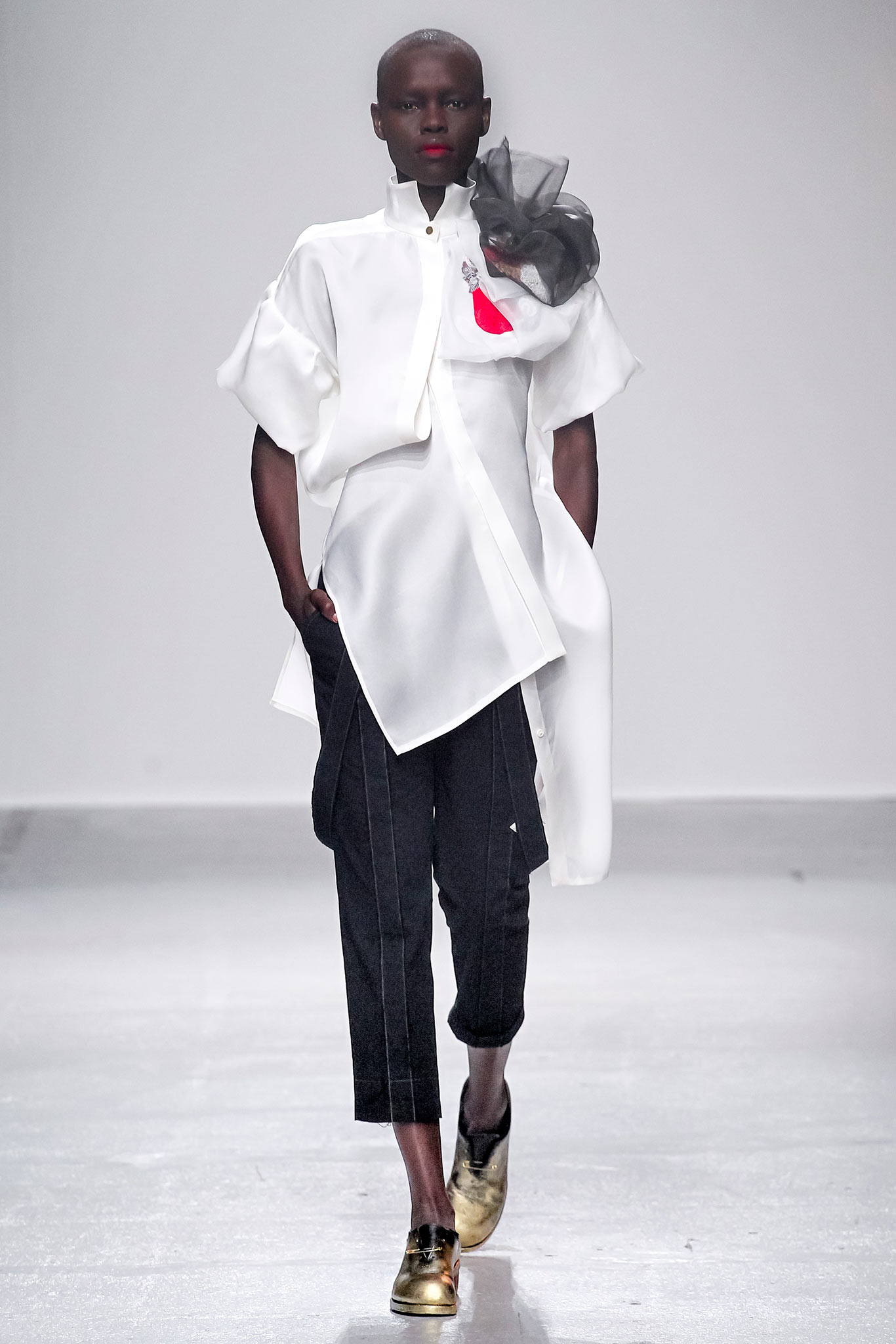 white relaxed shirt with black tailored pants