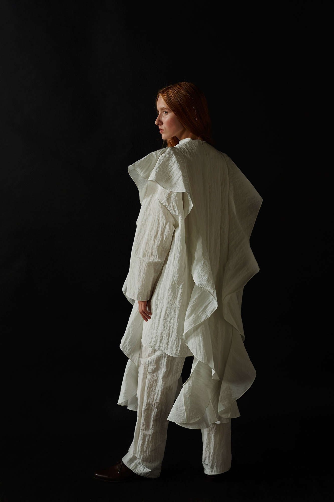 white cotton long-sleeve relaxed ruffled coat