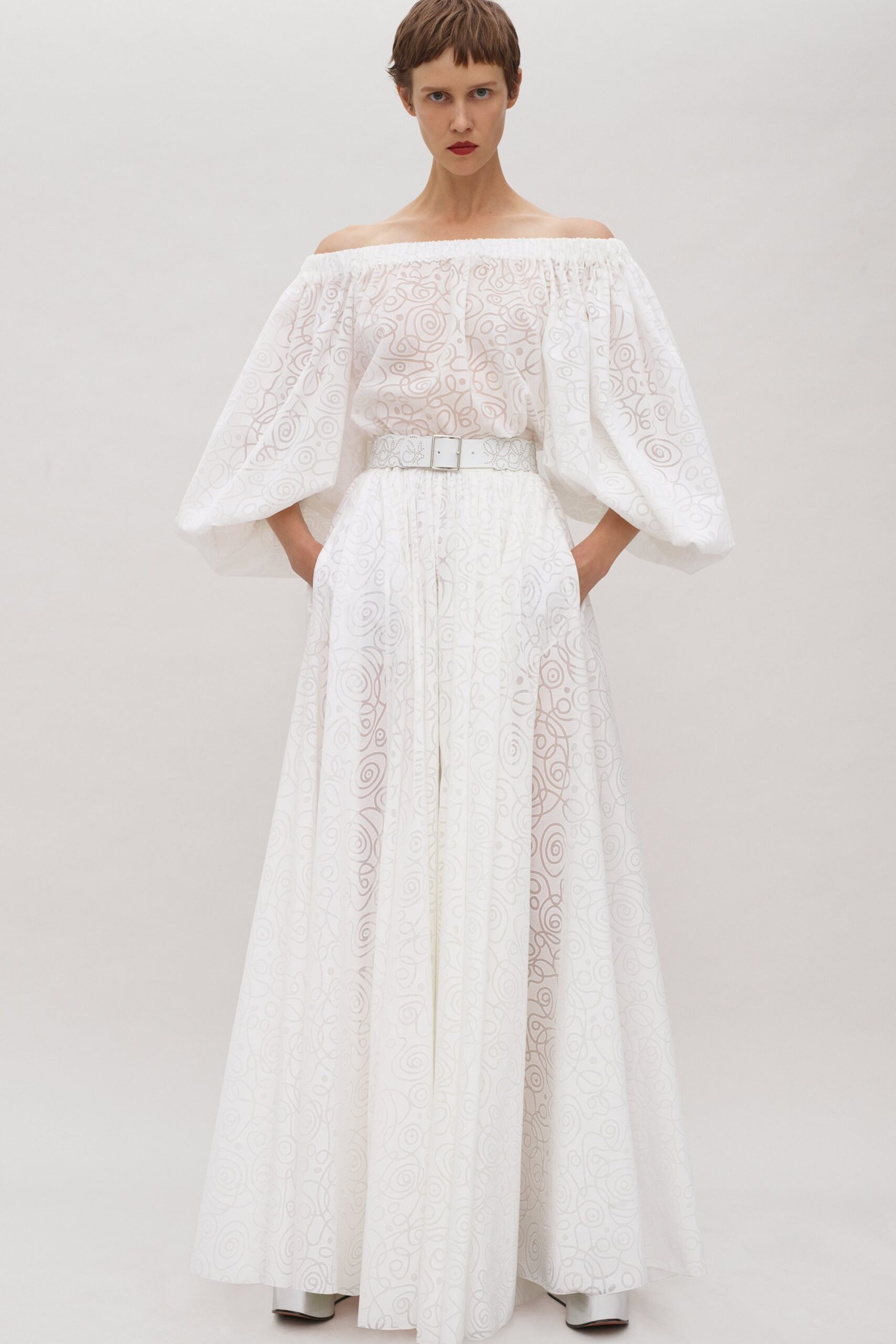 white off-shoulder pleated gown