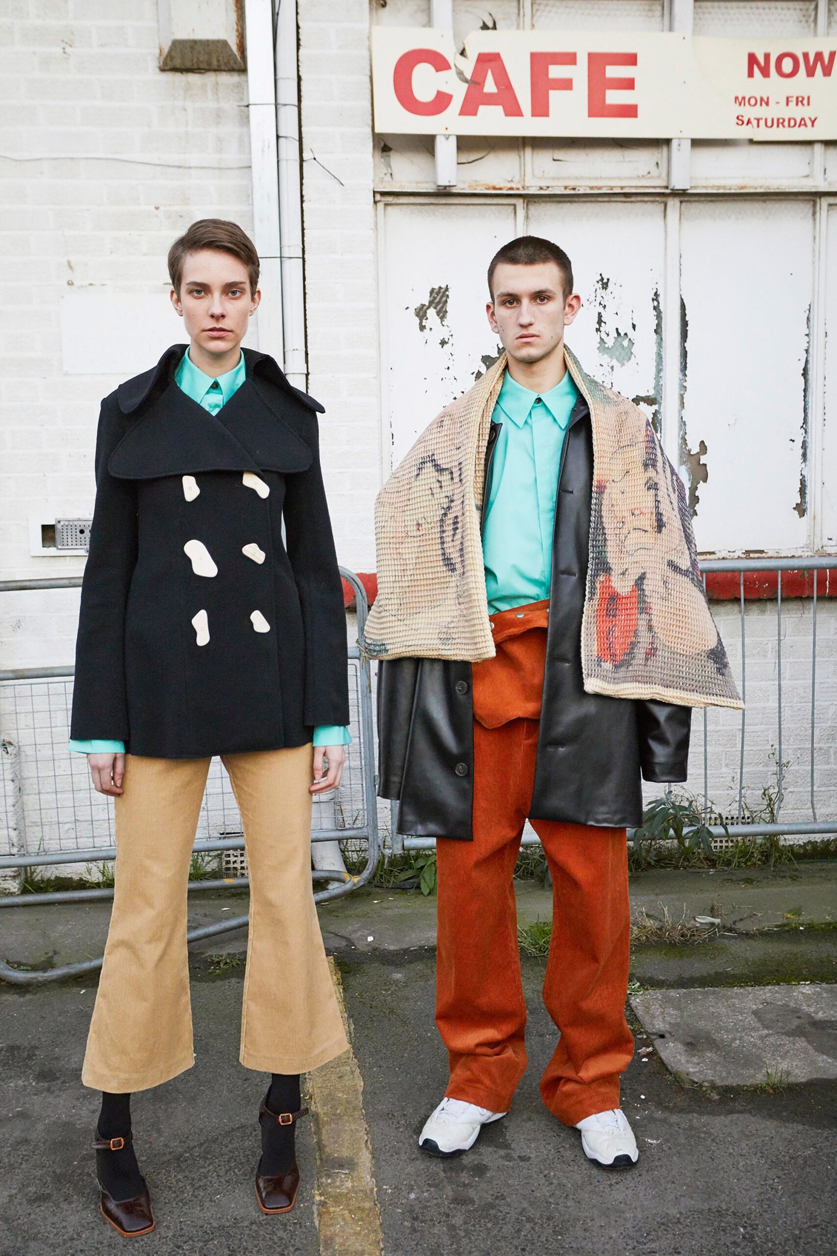 black wool coat with beige pants