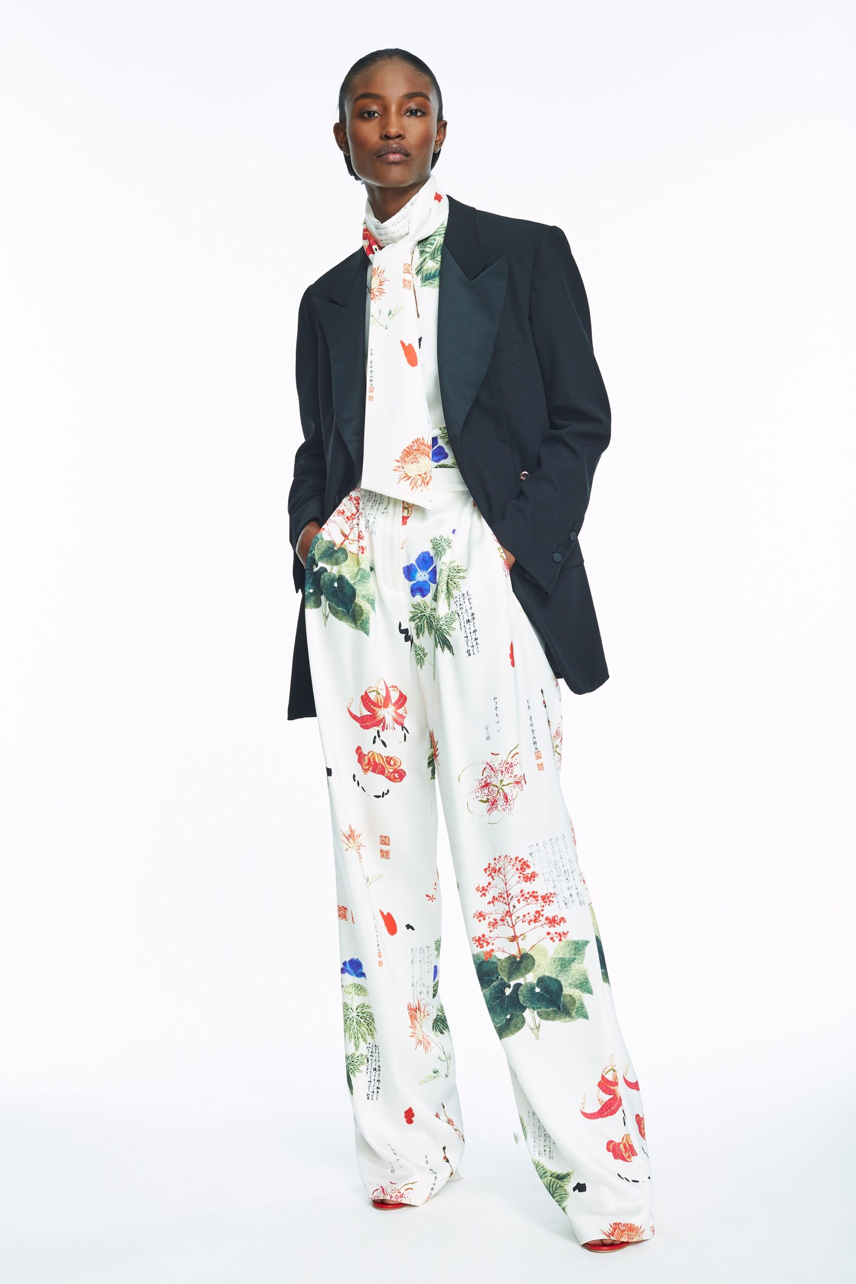 white sleeveless high-neck relaxed printed jumpsuit