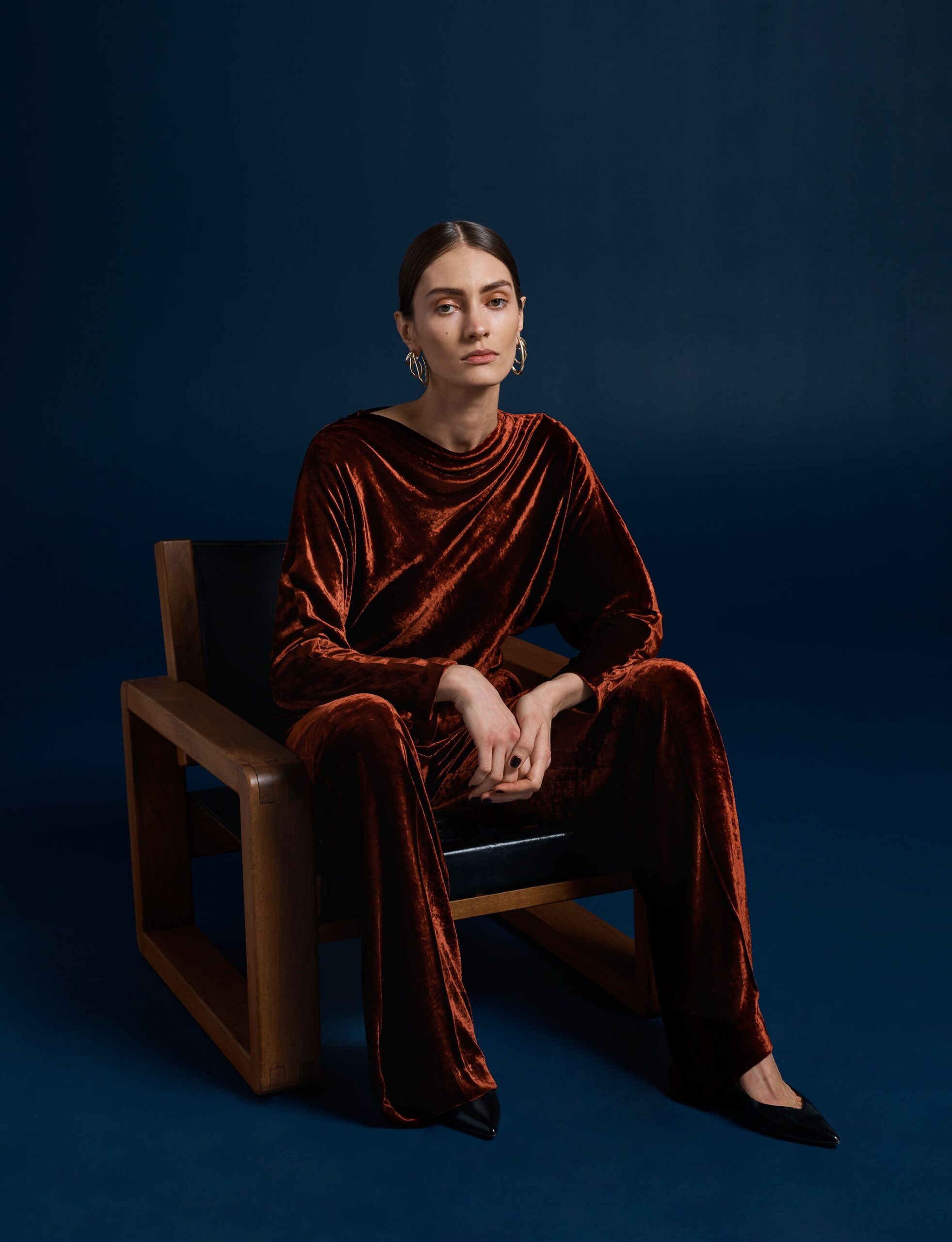 orange velvet long-sleeve high-neck relaxed shiny top