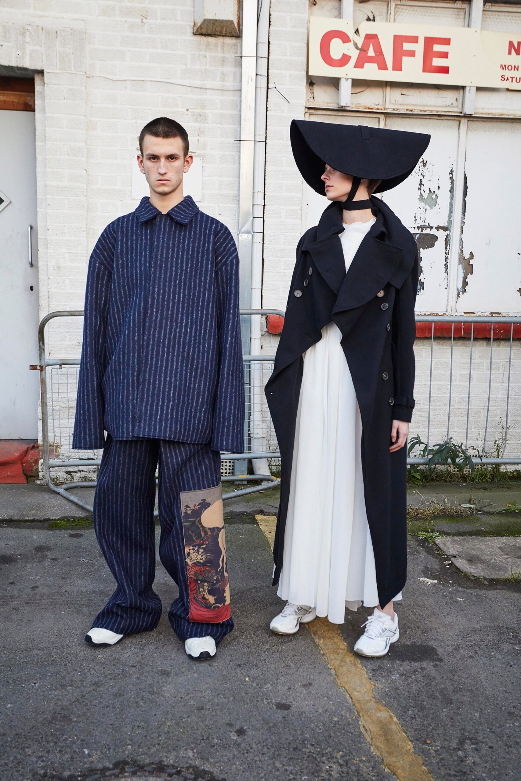 black coat white dress blue pants