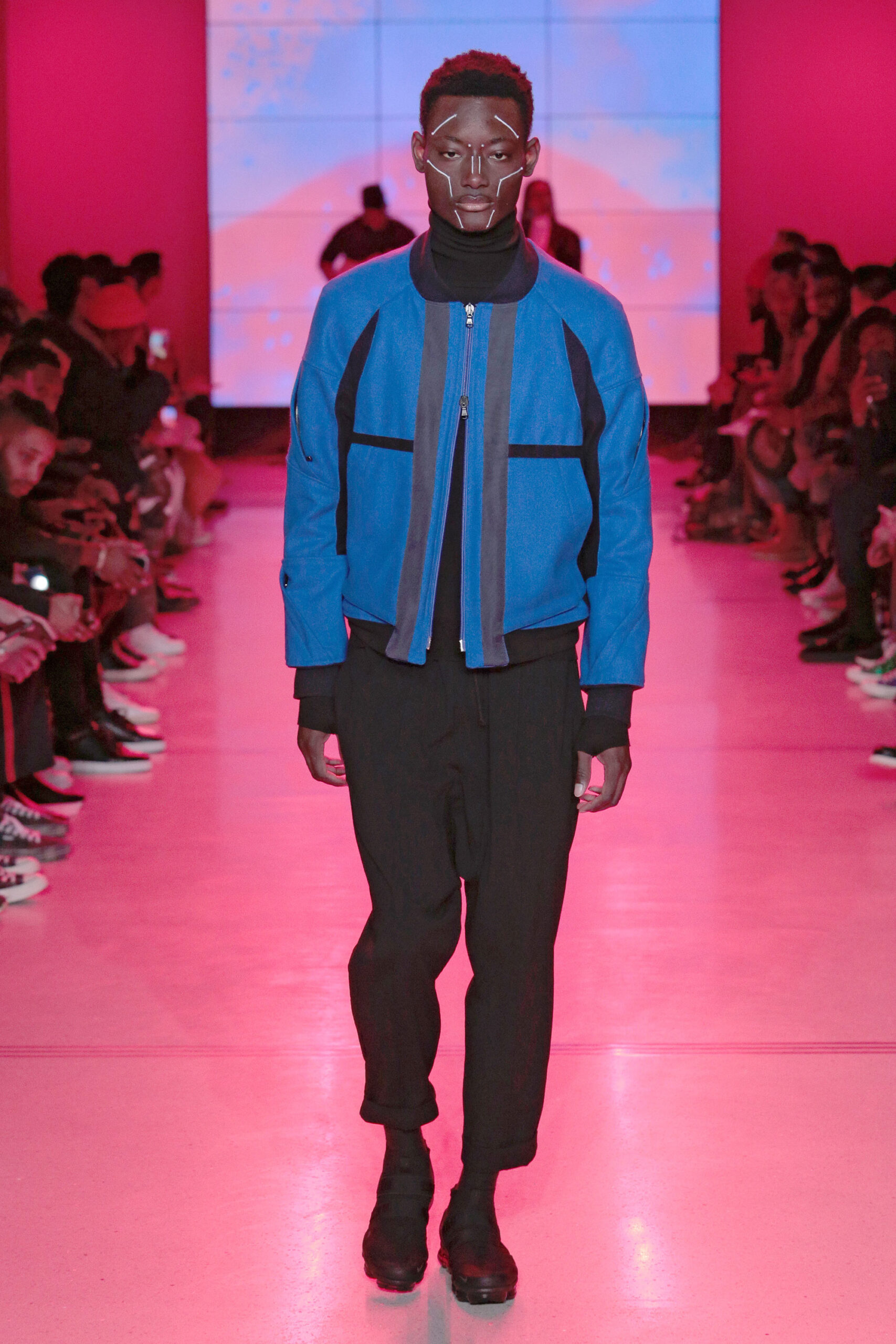 blue fitted jacket with black pants