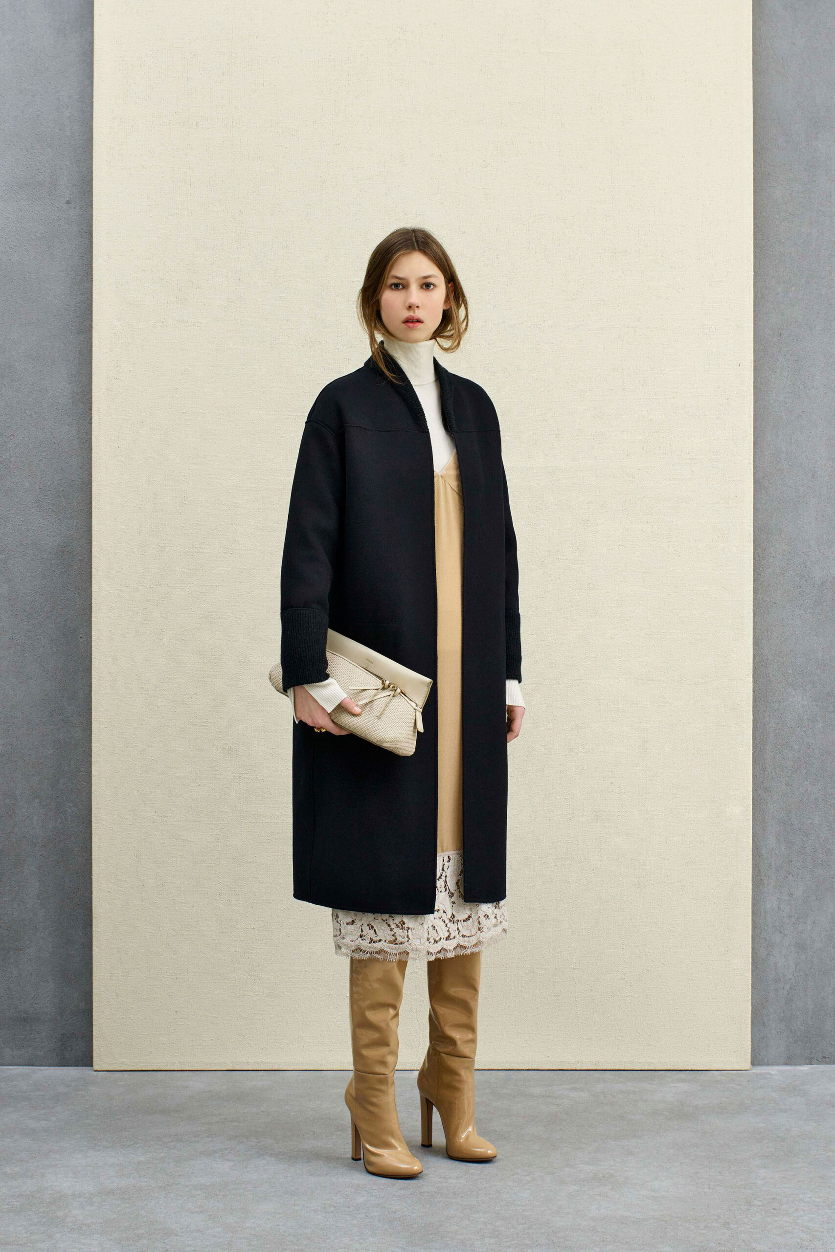 black wool coat beige dress