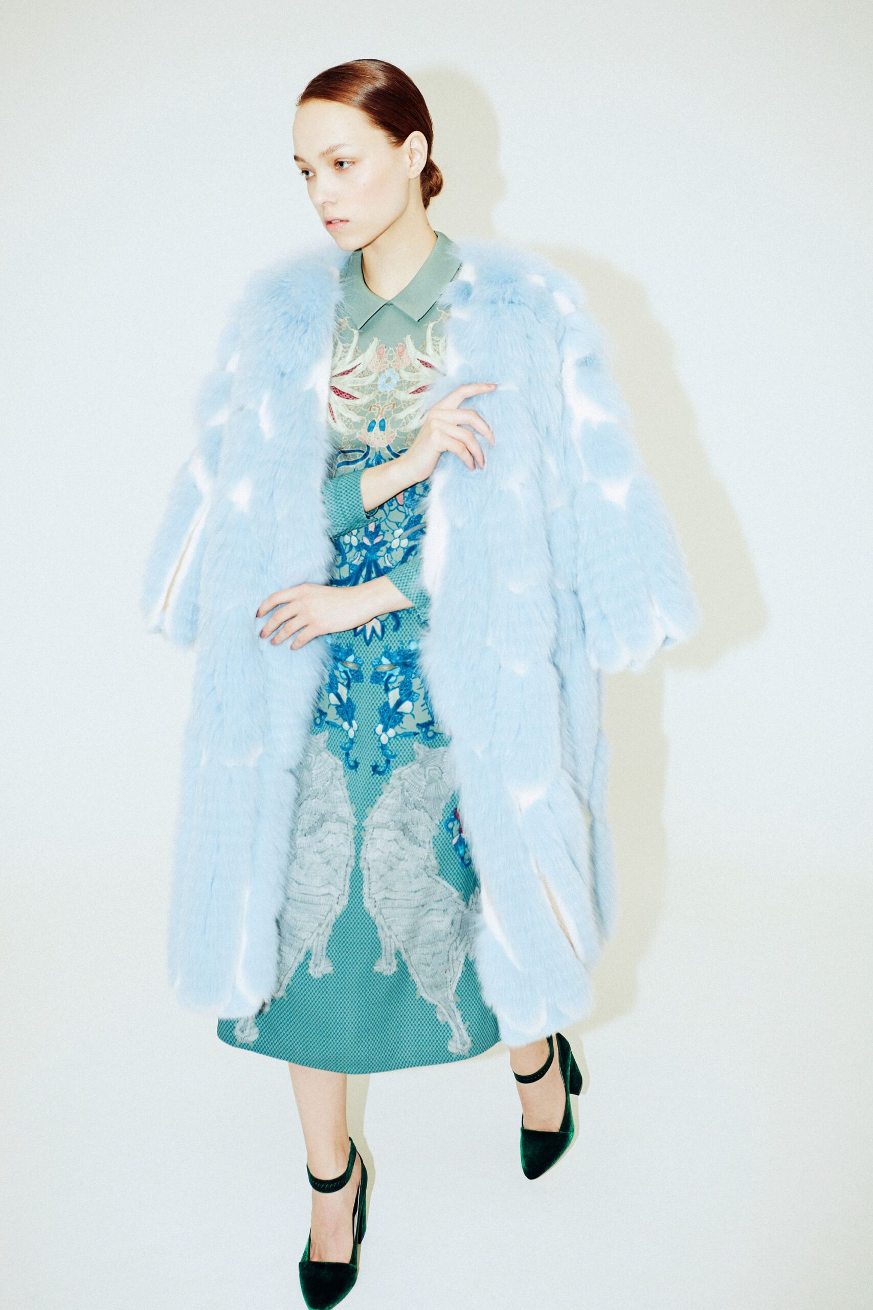 blue faux-fur coat and green silk dress