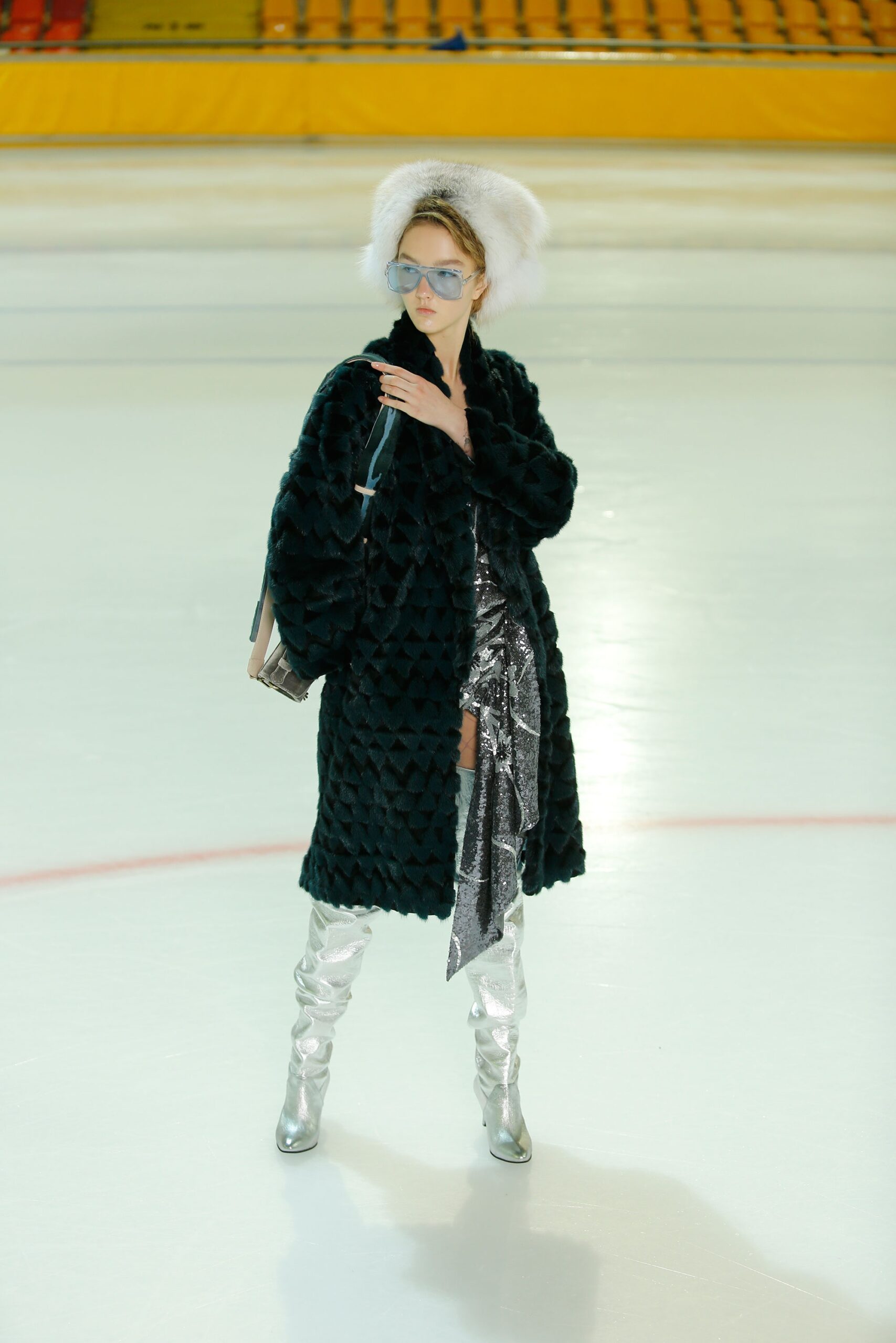 black faux-fur coat with silver dress