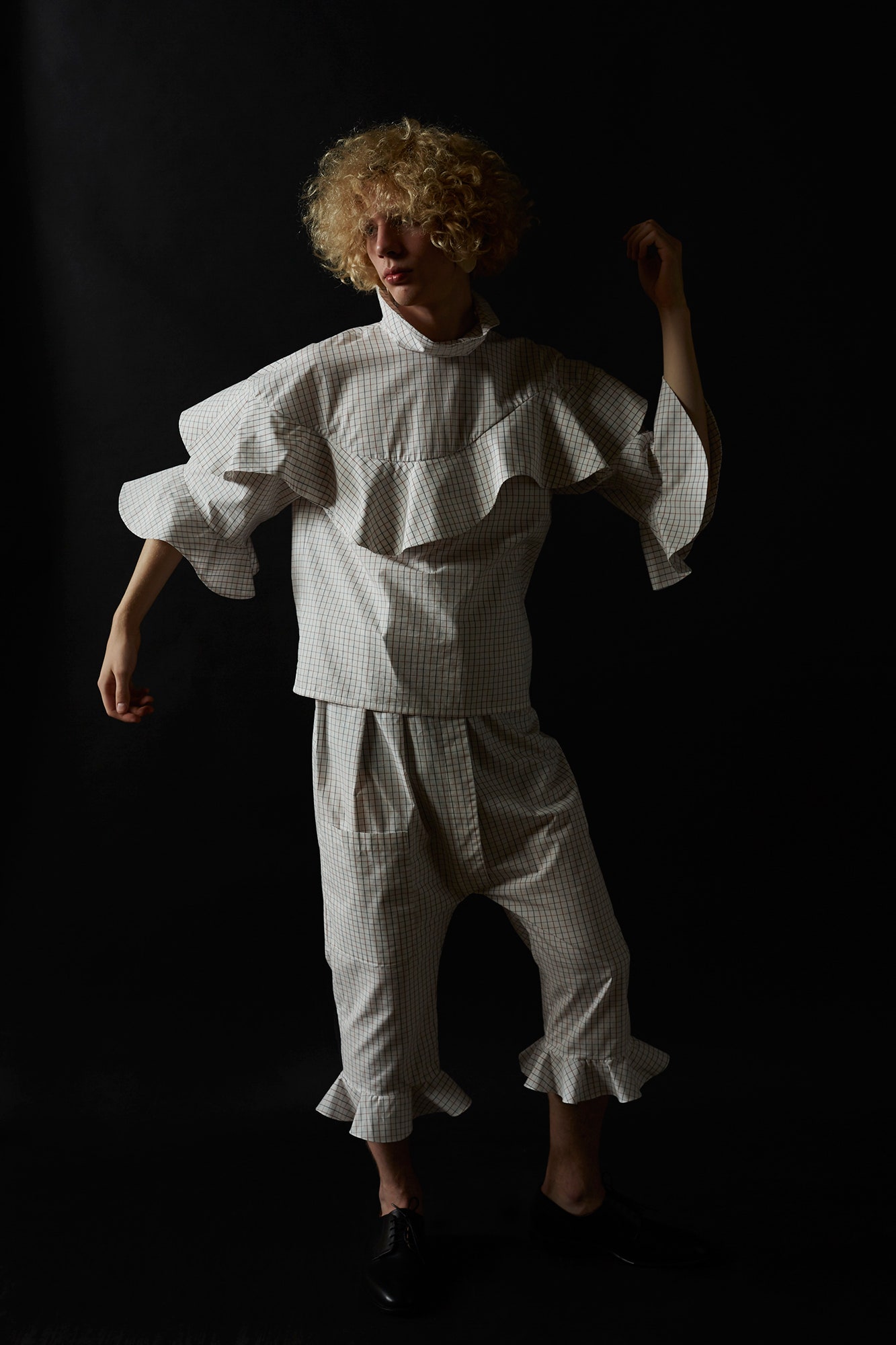 white ruffled top and pants