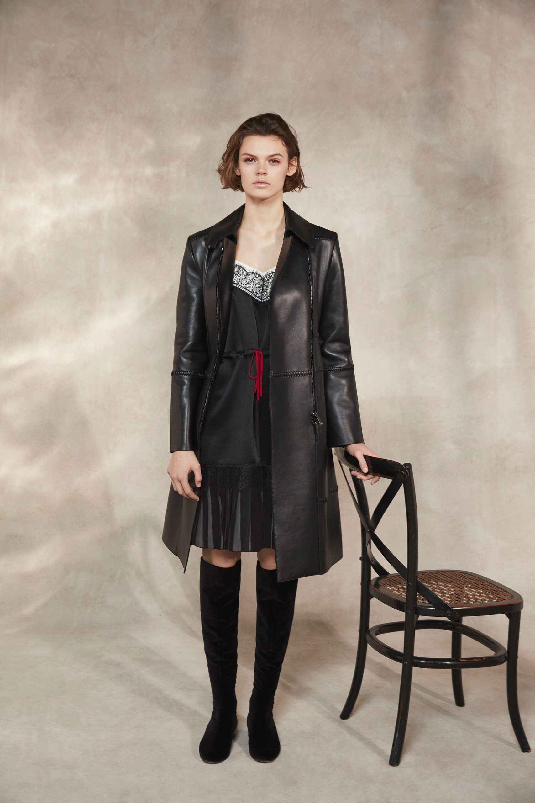 black leather coat and mini dress