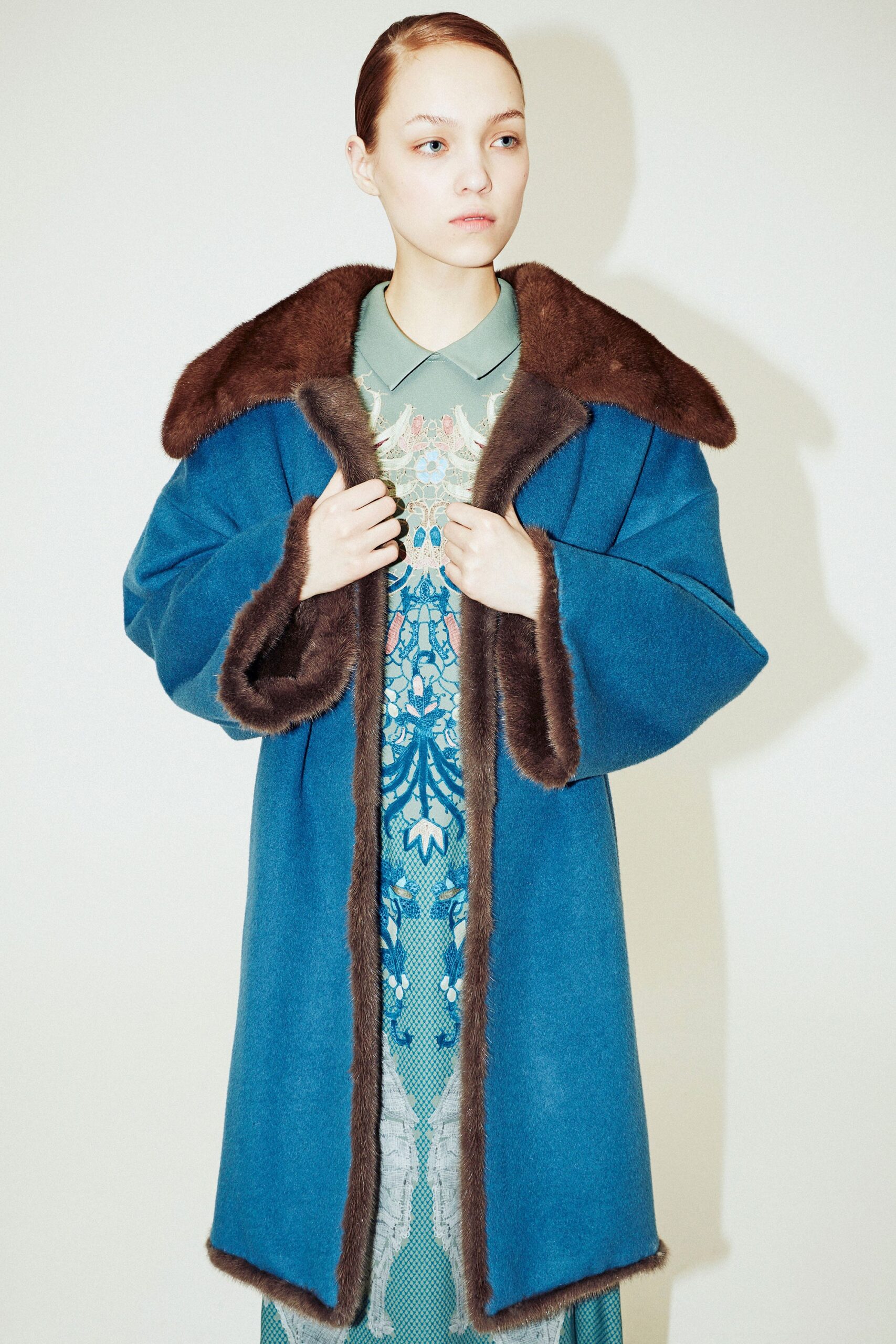 blue wool coat with green dress