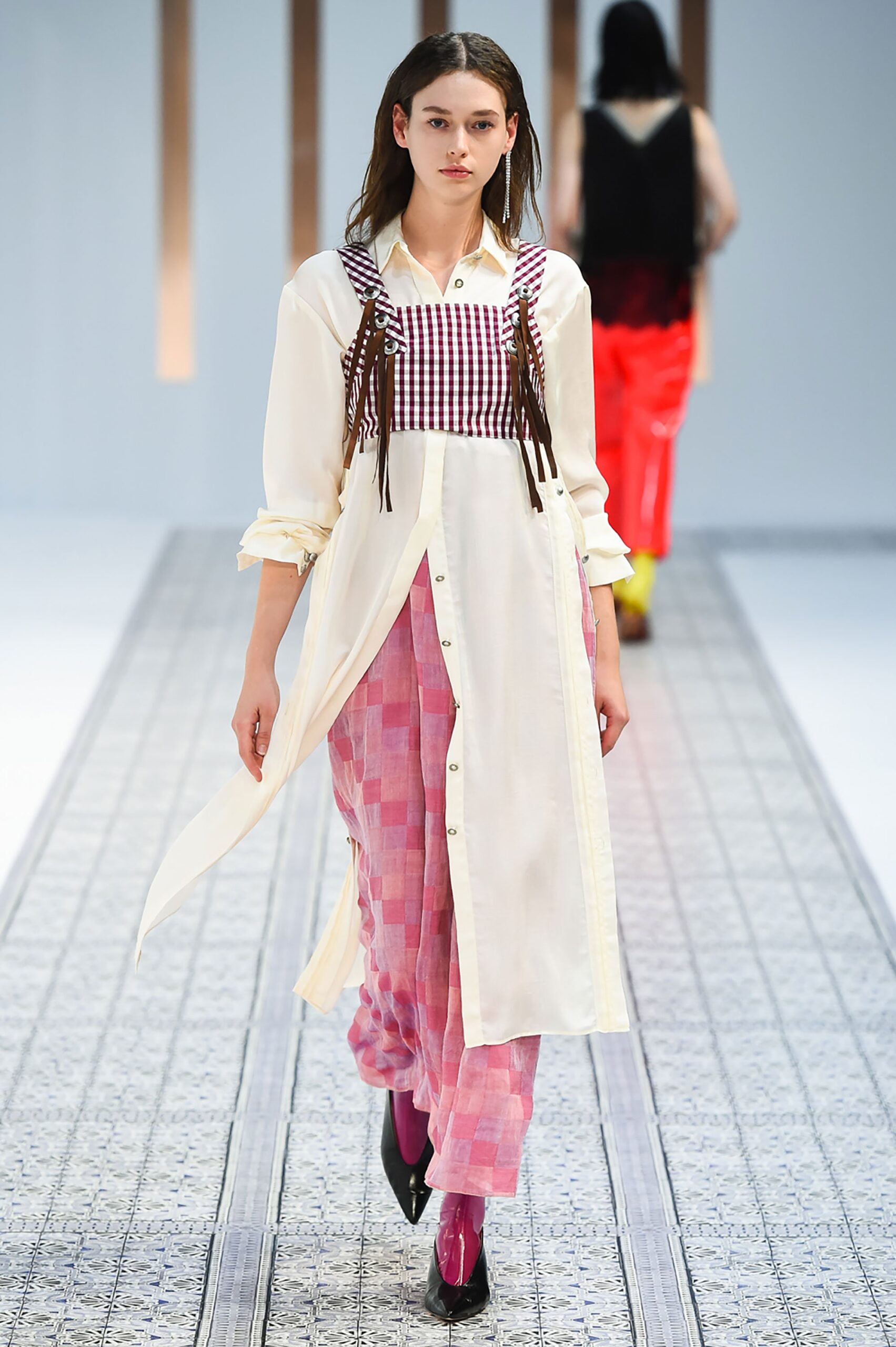 A relaxed white and pink layered dress with a collared neckline and checked design details.