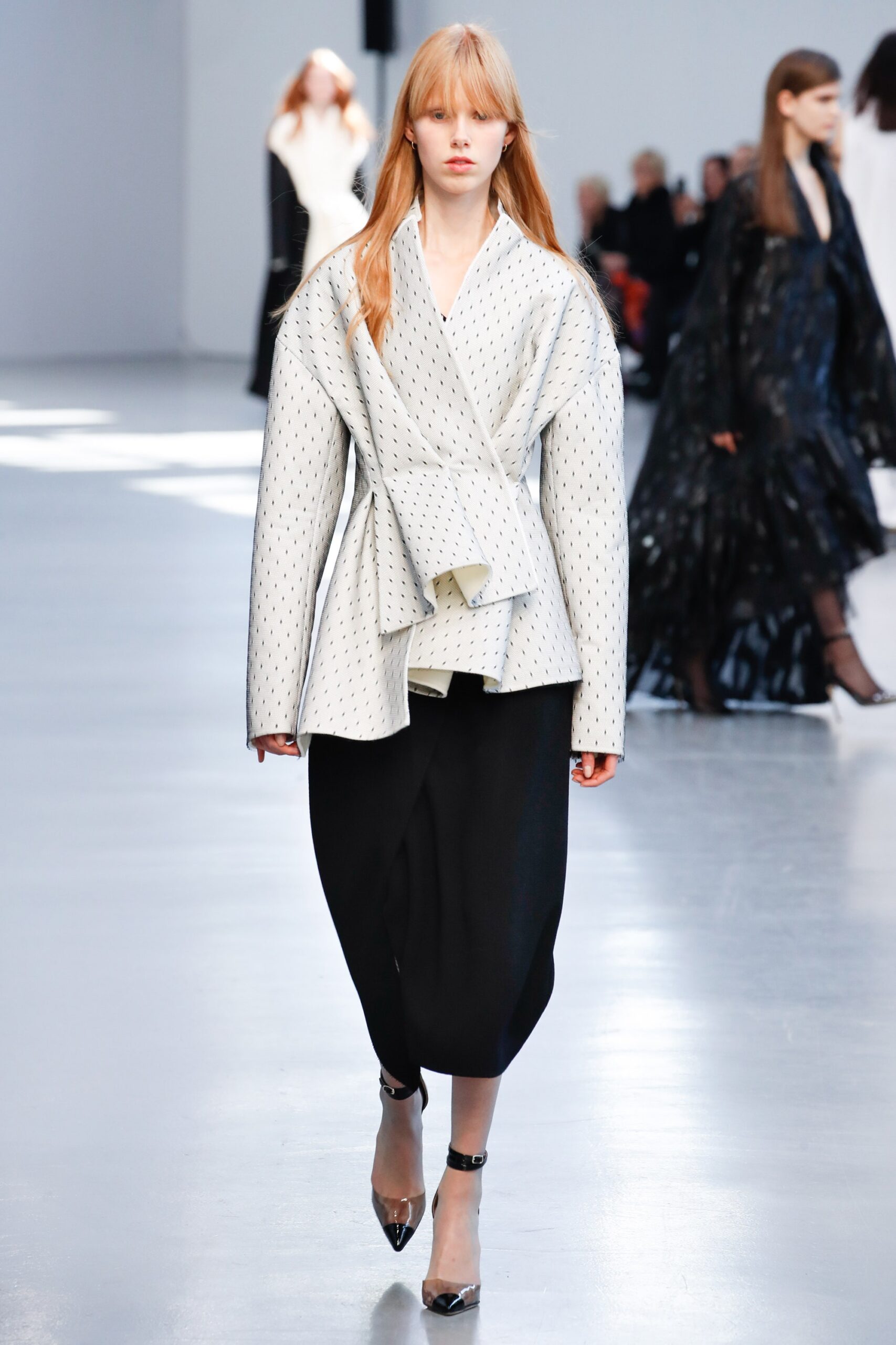 white relaxed jacket with black pants