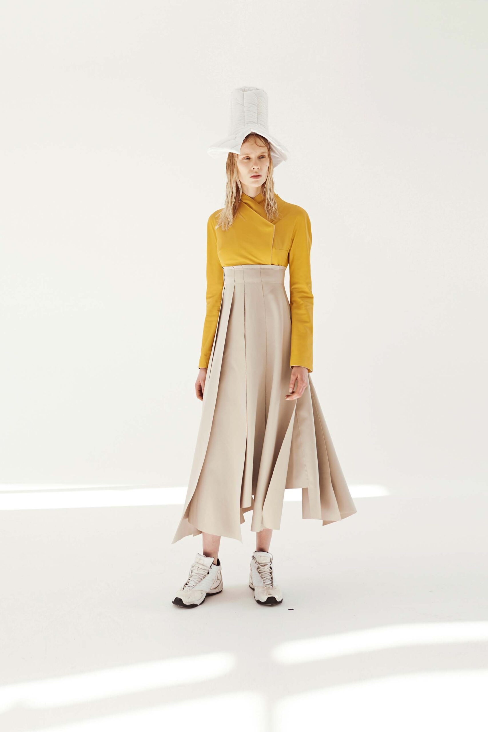 yellow top beige pleated skirt
