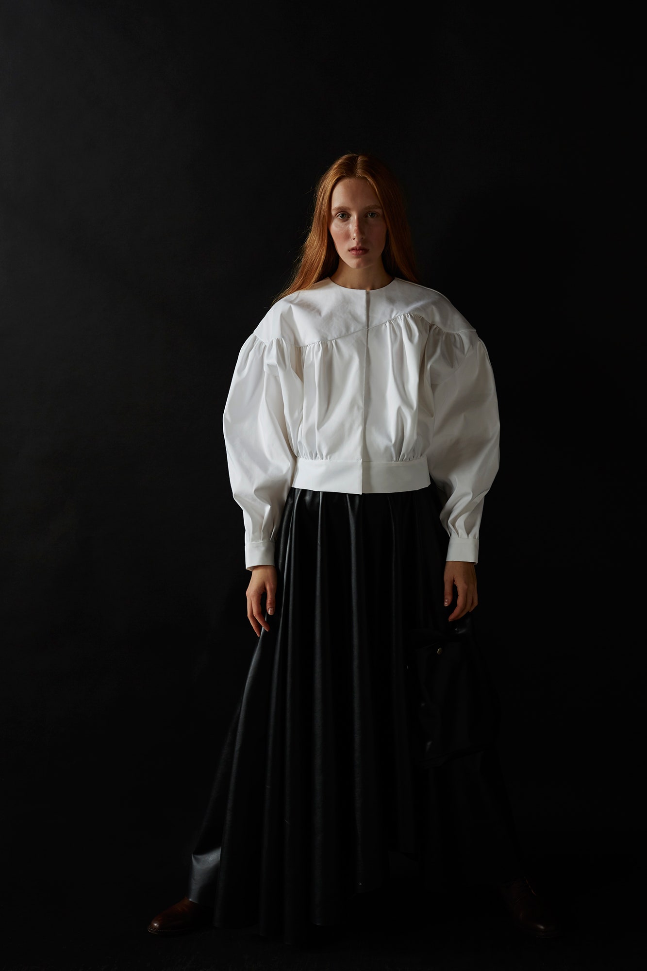 white cotton blouse and black skirt