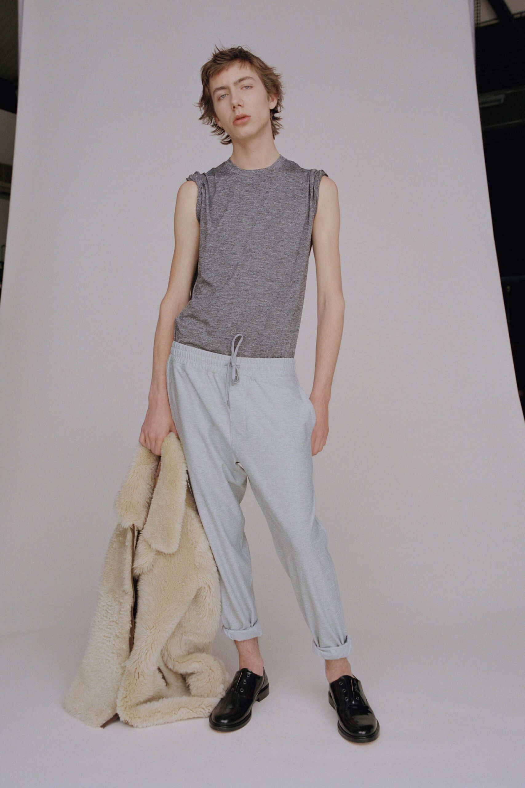 gray tank-top and relaxed pants