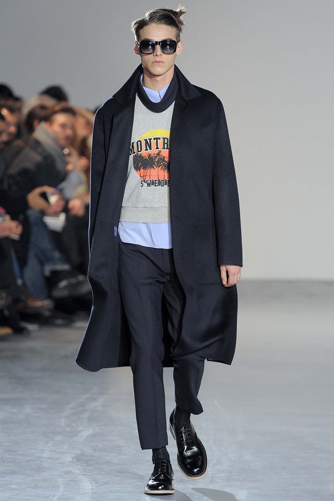 black wool coat gray sweater tailored pants