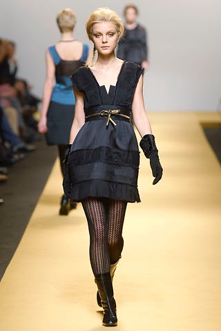 black fitted mini dress with gloves and boots