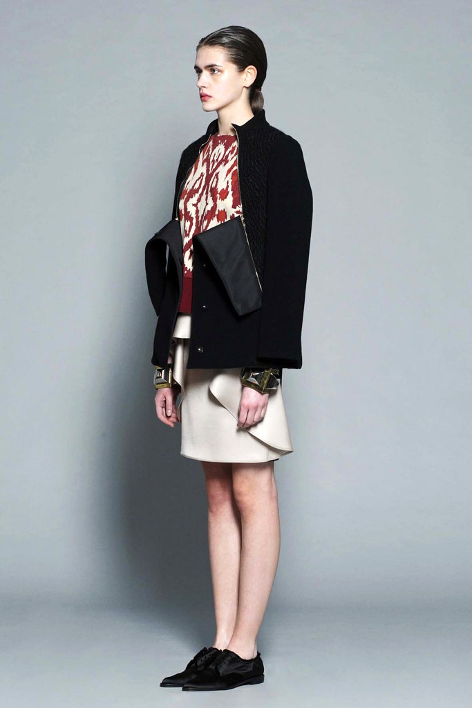 black wool coat with red sweater