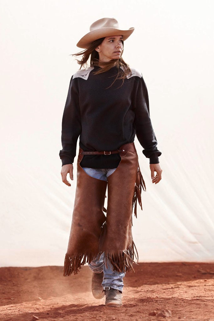 black sweater with brown leather skirt